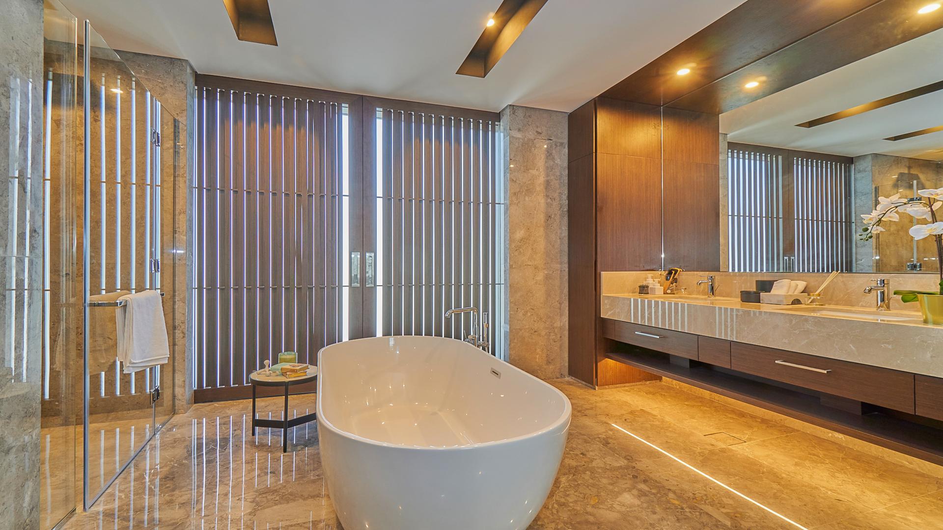 "Spacious outdoor patio of contemporary villa in Dubai Hills Estate, Golf Place community.",Luxurious bathroom with freestanding tub in Dubai Hills Estate villa, Golf Place