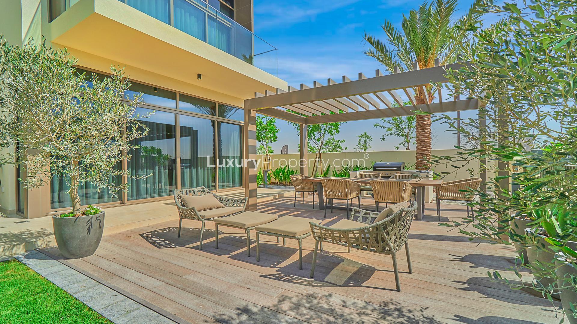 Contemporary living room in Dubai Hills Estate villa, spacious seating, modern decor, bright lighting