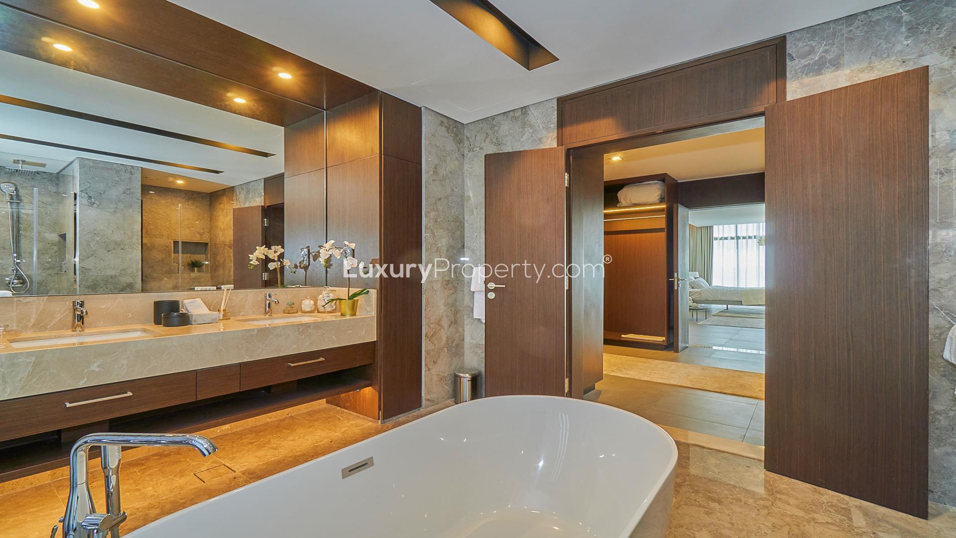 Outdoor patio of luxury villa in Dubai Hills Estate, Golf Place, with garden view