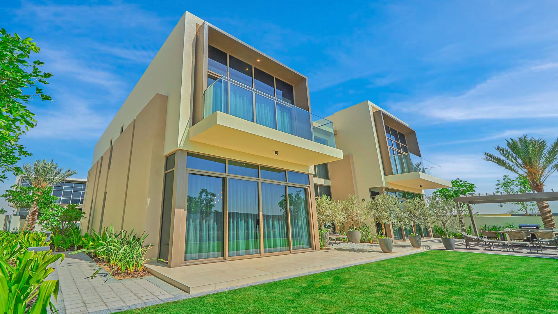 Modern living room in Dubai Hills Estate villa, featuring stylish decor and spacious seating