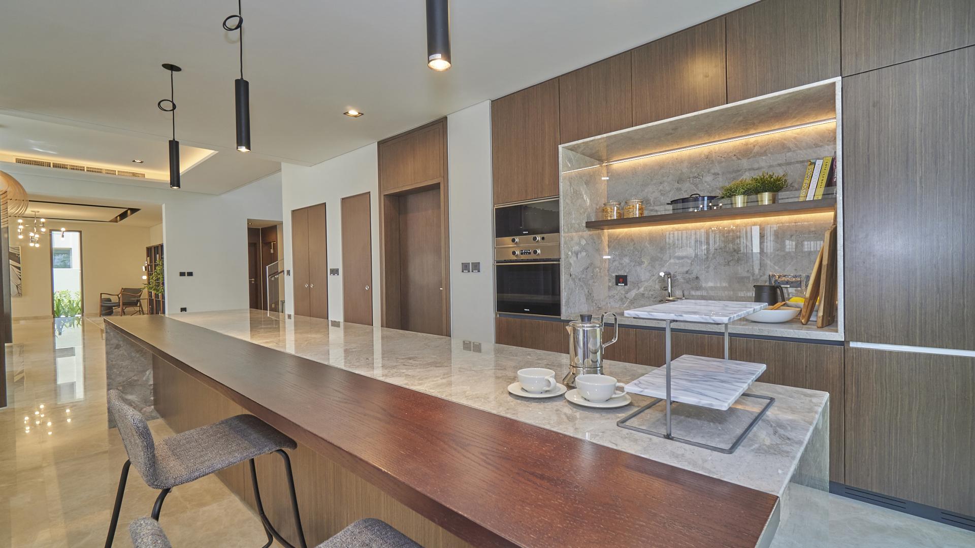 Modern kitchen in 5-bedroom villa, Golf Place, Dubai Hills Estate, featuring sleek design elements