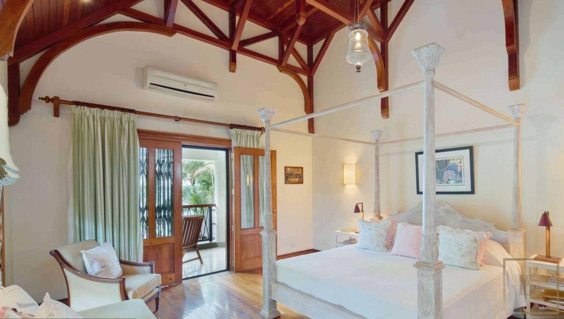 Modern kitchen in luxury Grand Bay villa, North Mauritius, featuring sleek appliances and wood cabinetry