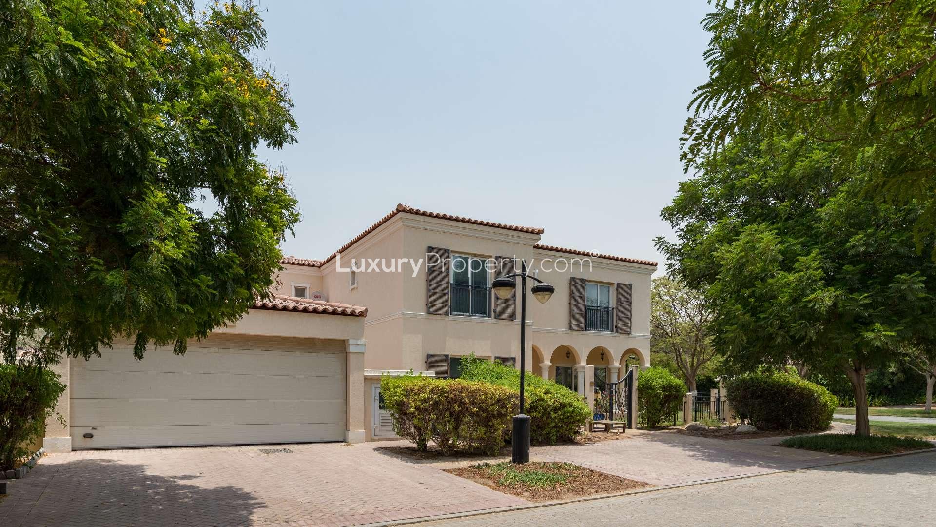 5-bedroom villa exterior in Green Community West, Dubai, lush garden, gated entrance