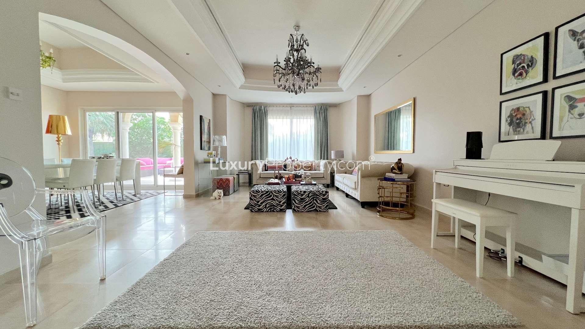 Spacious living room in upgraded villa, Green Community West, featuring elegant decor and natural light