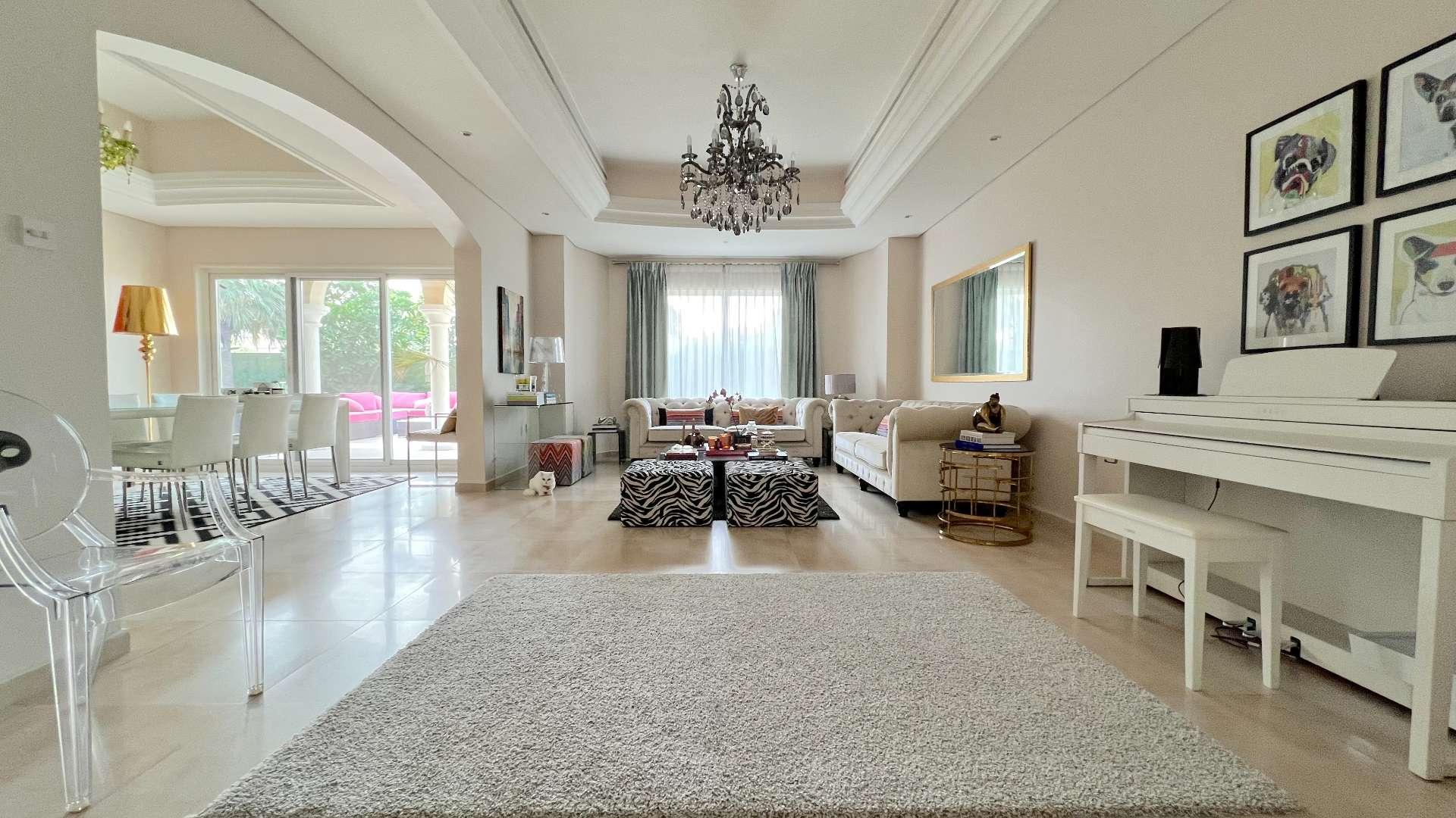 Spacious living room in upgraded villa, Green Community West, featuring elegant decor and natural light