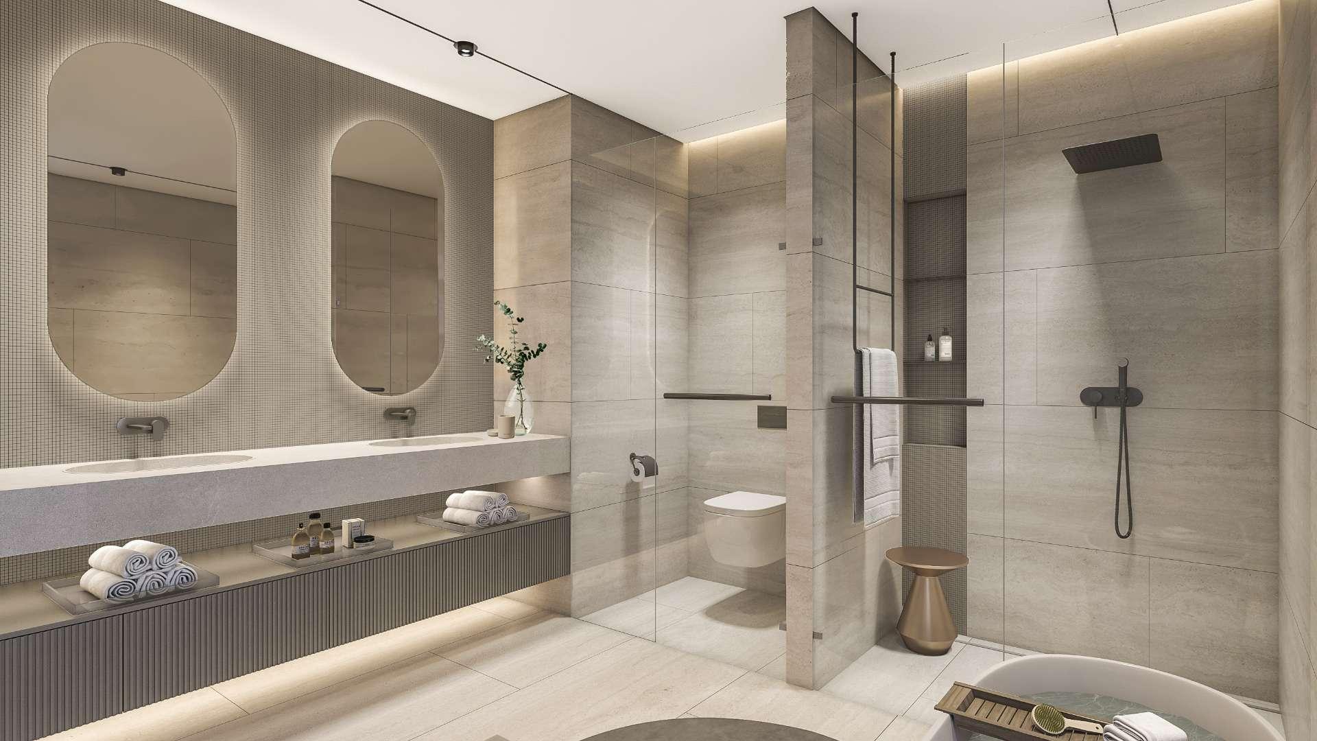 "Modern 5-bedroom villa with pool, terrace, and garden in Tilal Al Ghaf for sale.",Modern bathroom in Tilal Al Ghaf villa, featuring dual sinks and spacious shower area