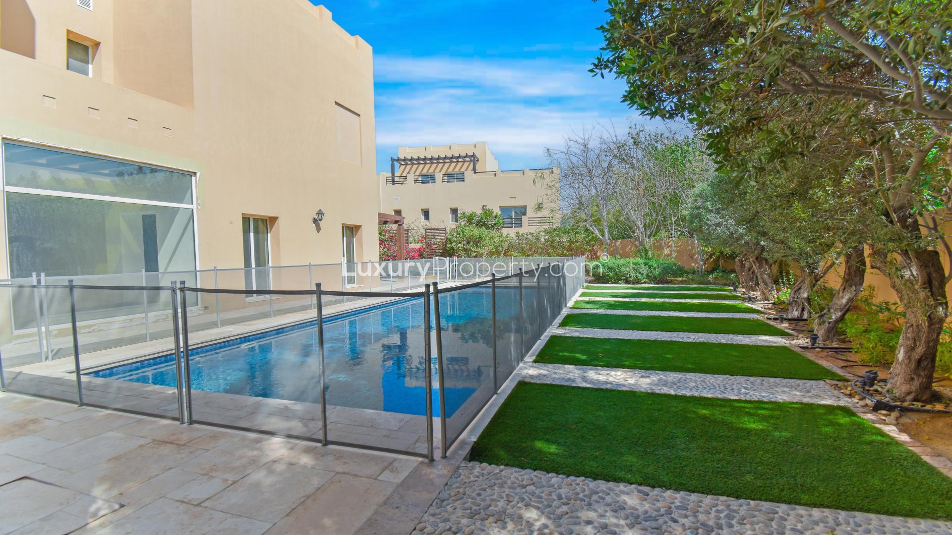 Upgraded 5-bedroom villa exterior with lush garden in Hattan Executive 2, Arabian Ranches, Dubai