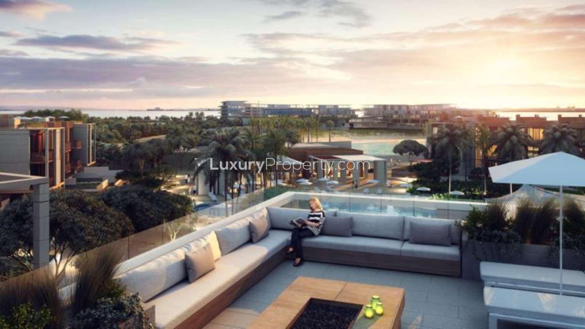 Luxurious master bedroom with modern decor in Jumeirah Bay Island villa, sea views visible