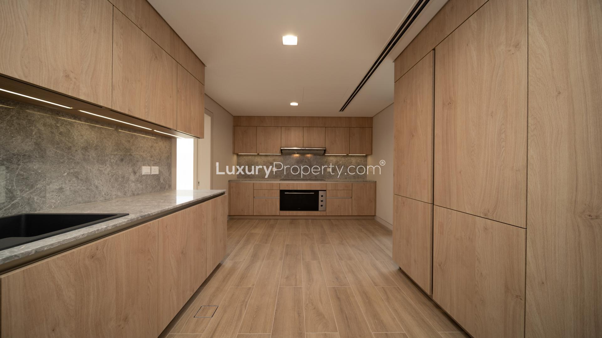 Spacious living area with large windows in Jumeirah Bay Island townhouse for sale