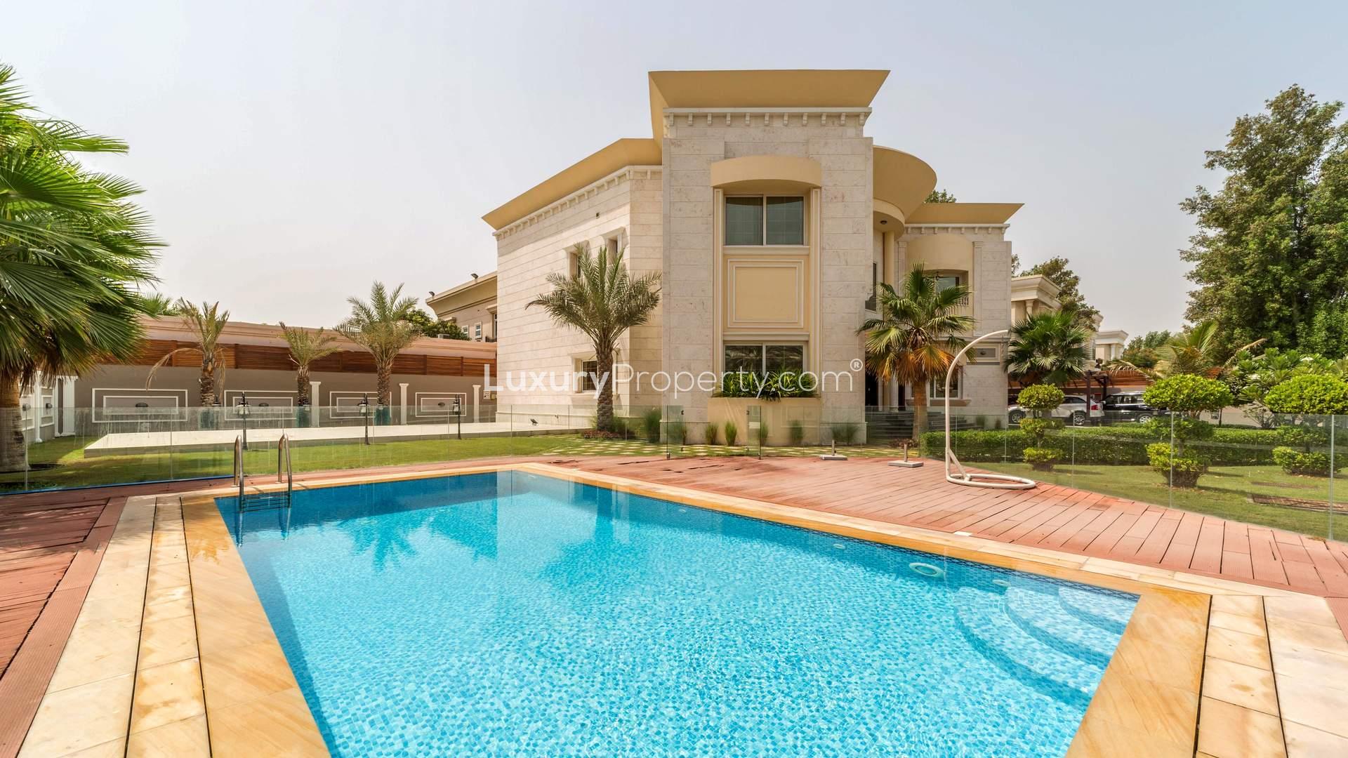 Elegant living room in Jumeirah villa with luxurious decor and ample natural light