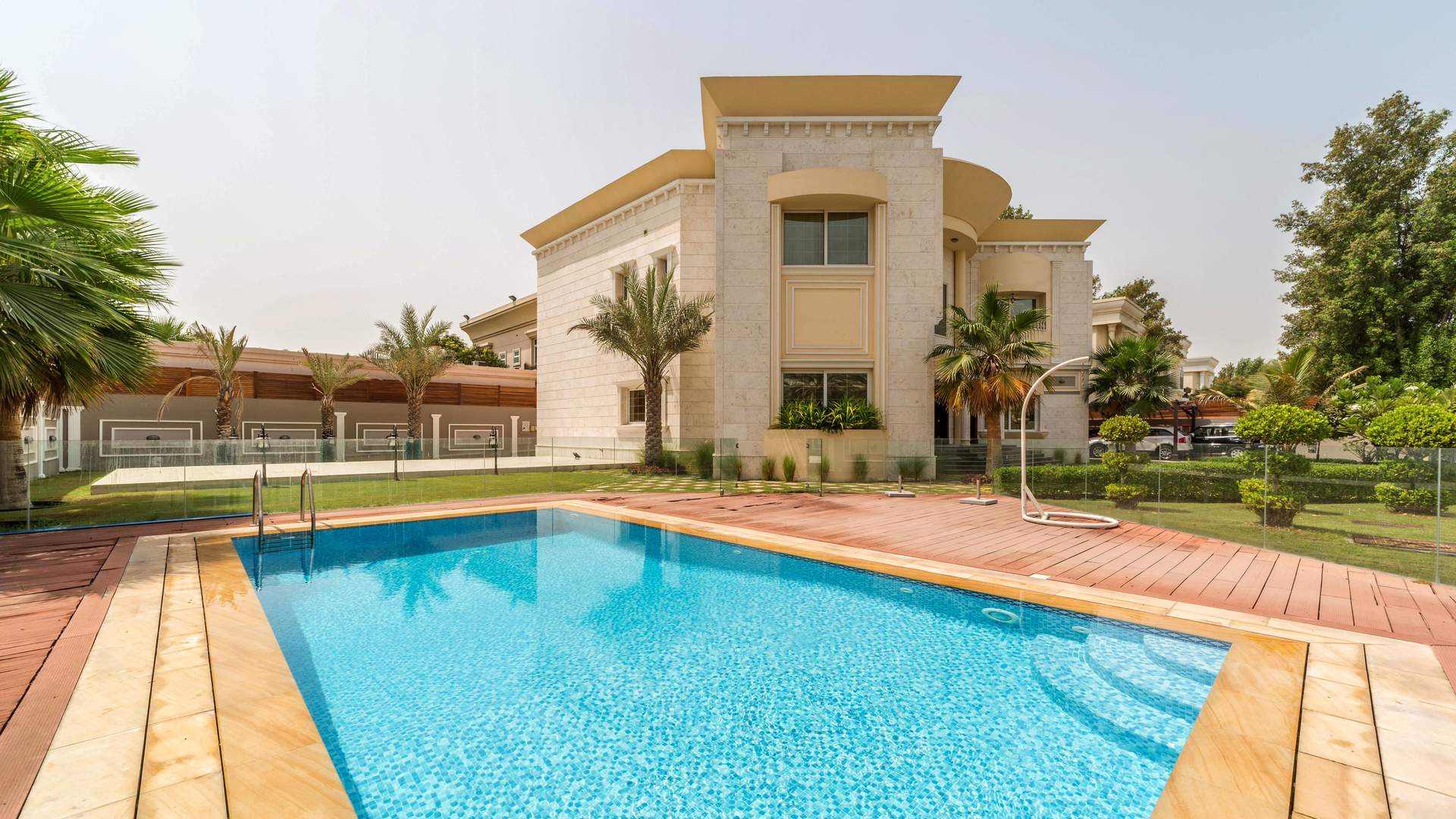 Elegant living room in Jumeirah villa with luxurious decor and ample natural light