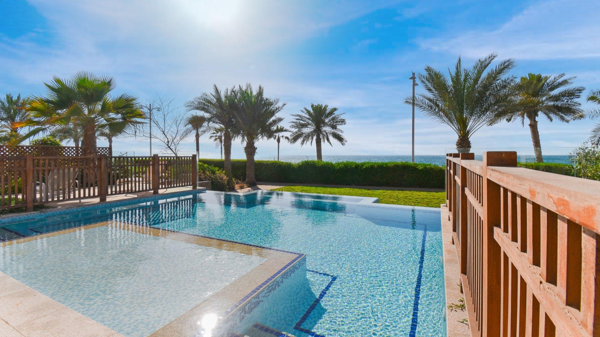 Luxurious living room in fully furnished Palm Jumeirah villa, modern decor, spacious seating area