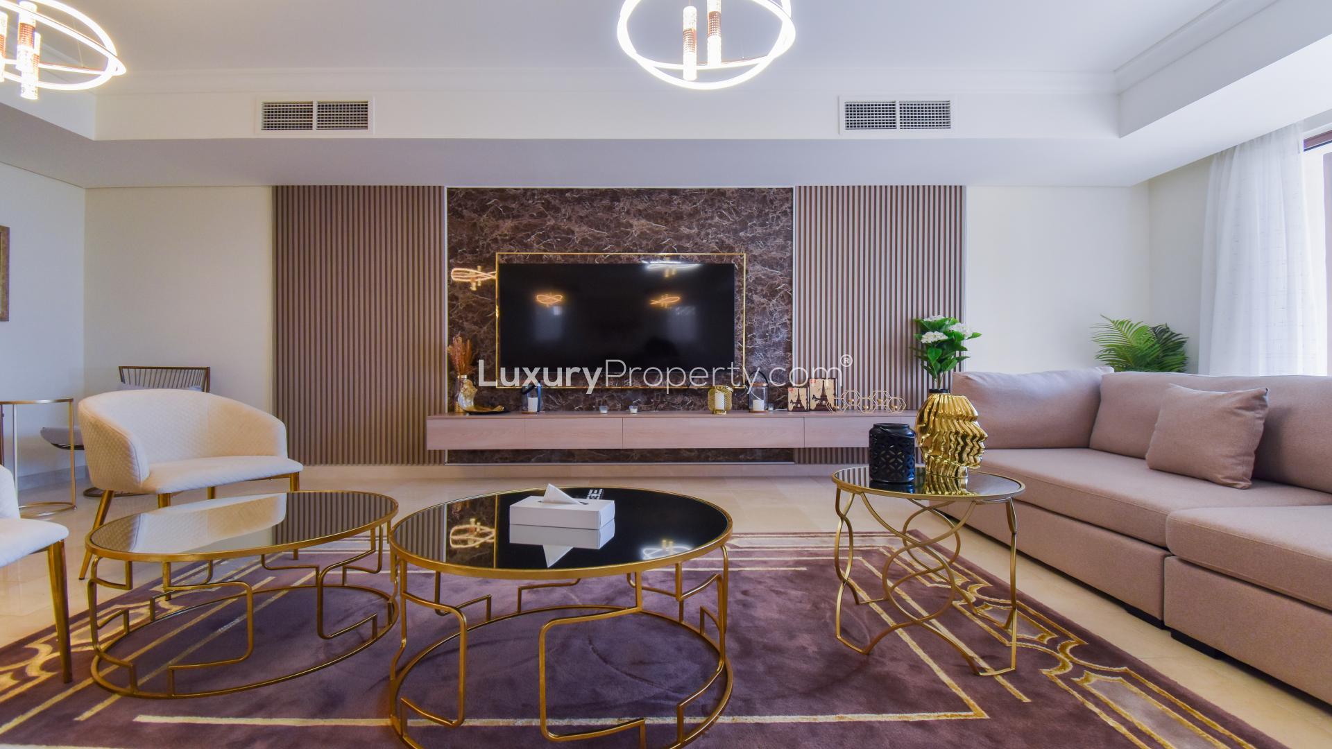 Oceanfront view from Palm Jumeirah villa, showcasing lush greenery and serene waters