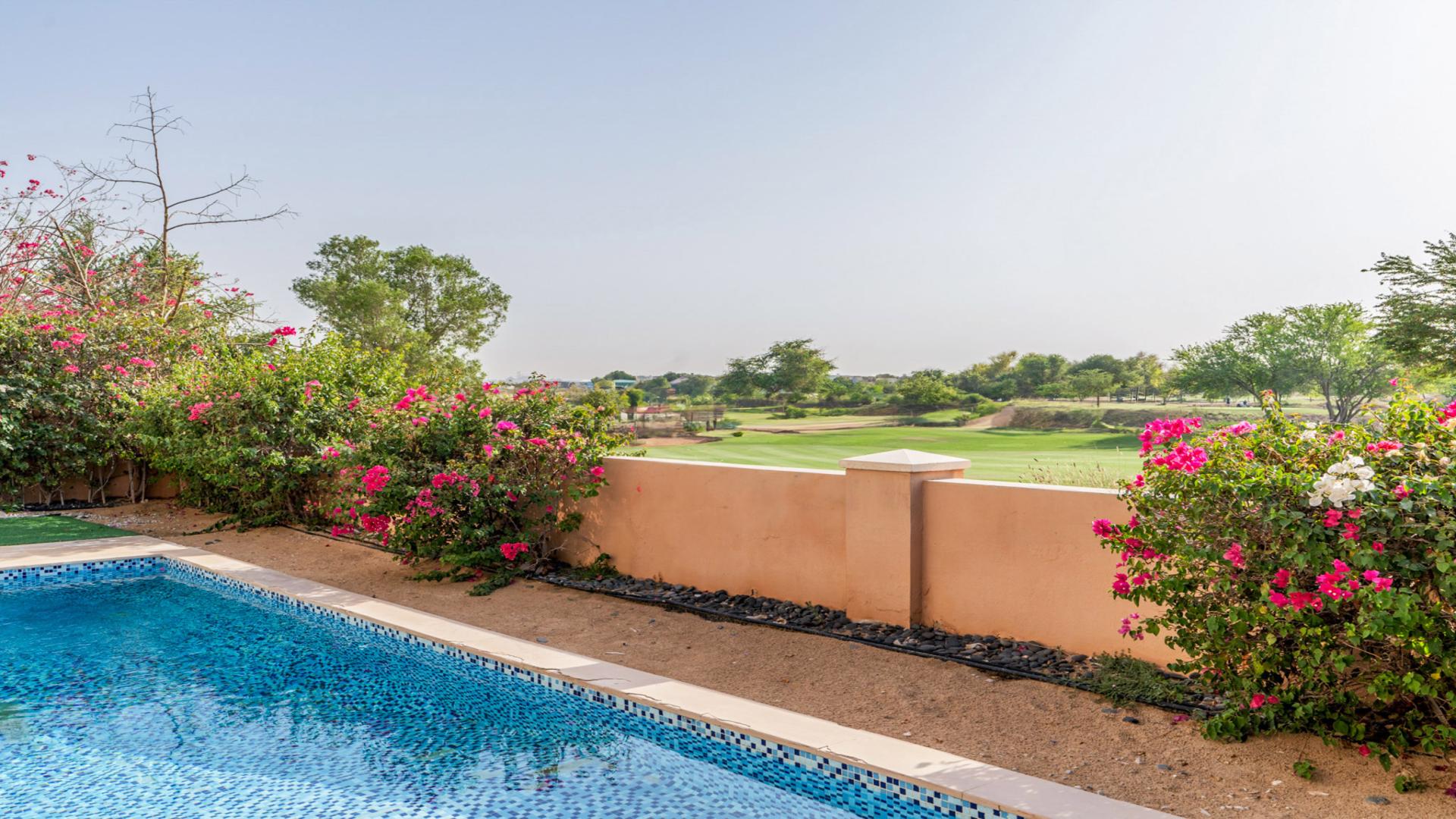 Modern living room in Sienna Views Villa, Jumeirah Golf Estates, with poolside view