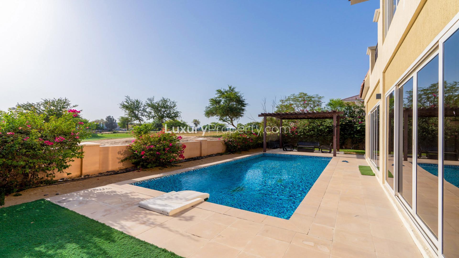 "Spacious Sienna Views Villa interior with pool and golf course view in Jumeirah Golf Estates.","Luxury Sienna Views Villa with private pool and golf course view, Jumeirah Golf Estates.",Private pool with golf course view at Sienna Views Villa, Jumeirah Golf Estates