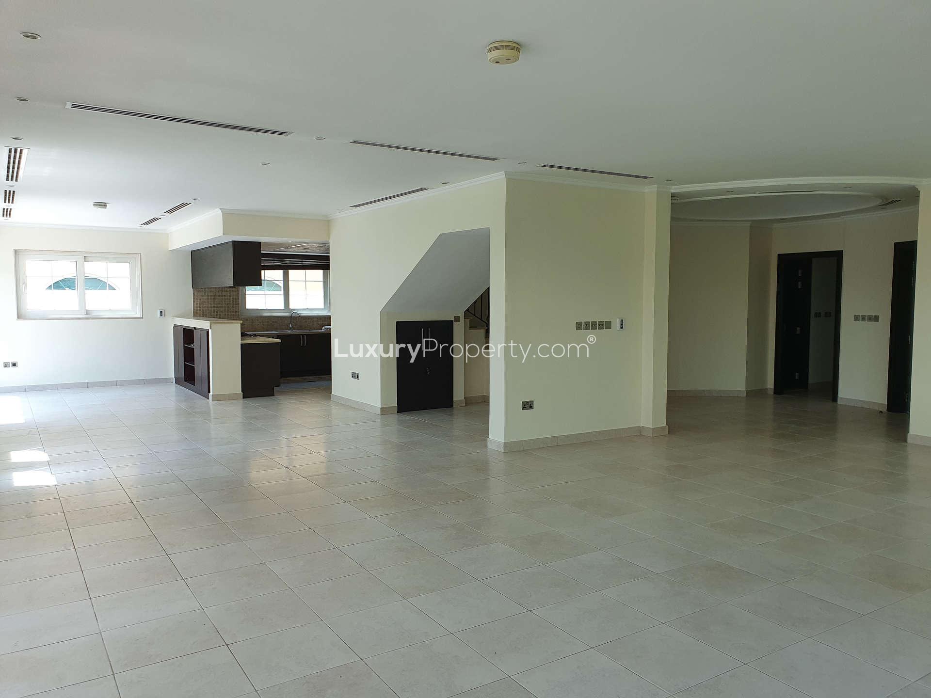 Spacious open-plan living area in Jumeirah Park Legacy villa with modern kitchen