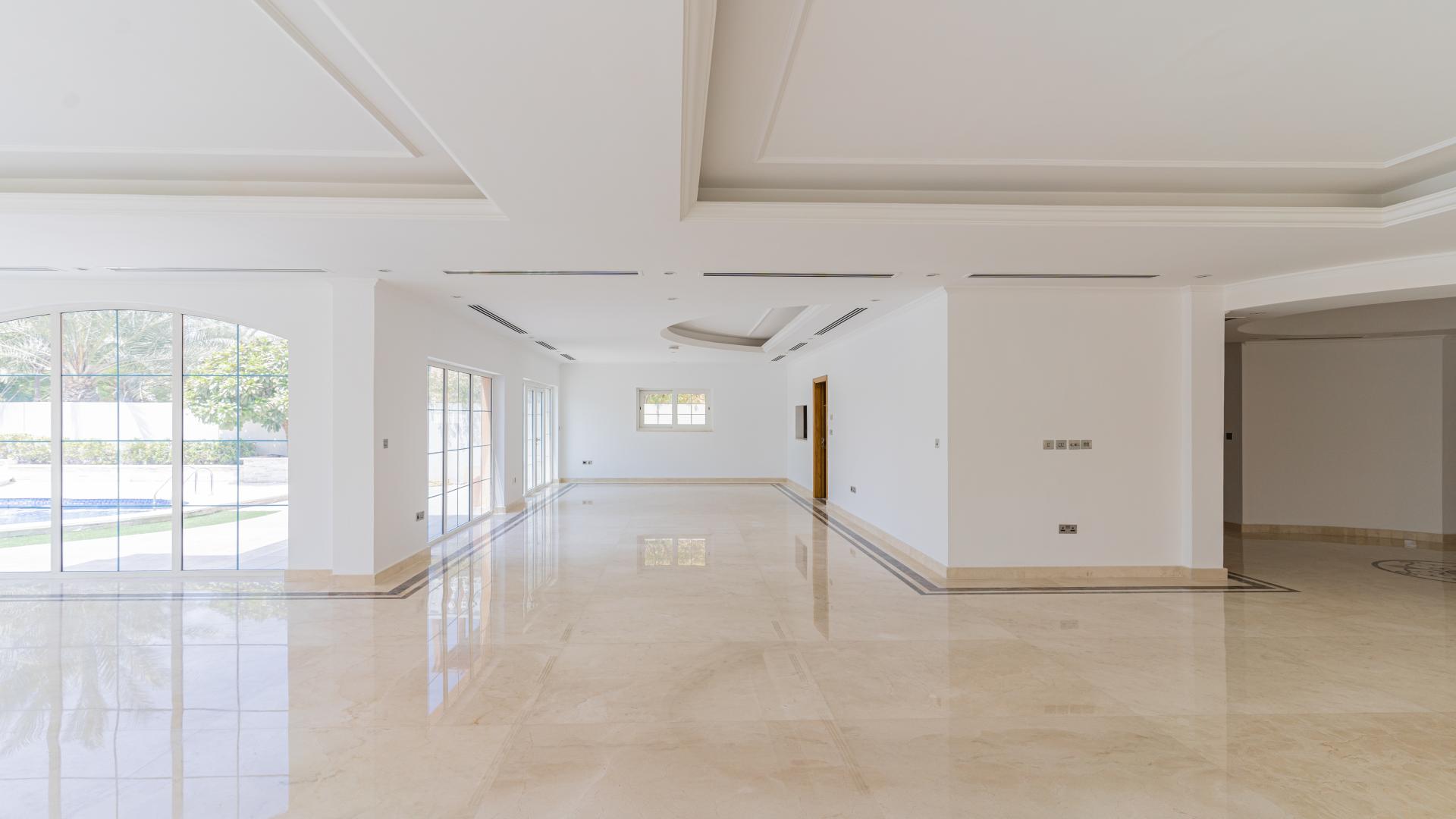 Spacious living area with large windows in newly renovated Jumeirah Park villa for sale