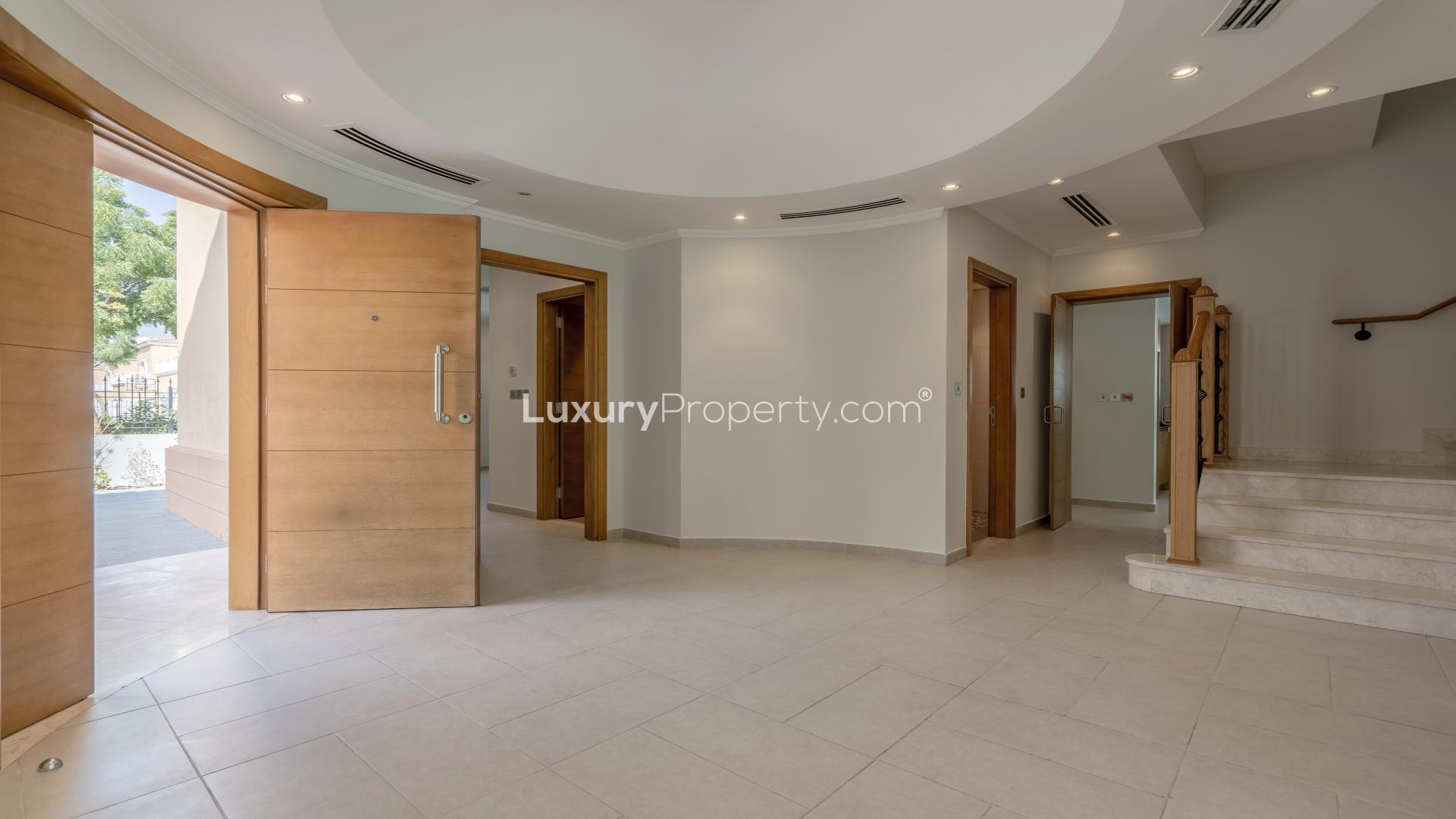 Beautiful Jumeirah Park villa exterior with balcony and lush greenery, Legacy sub-community