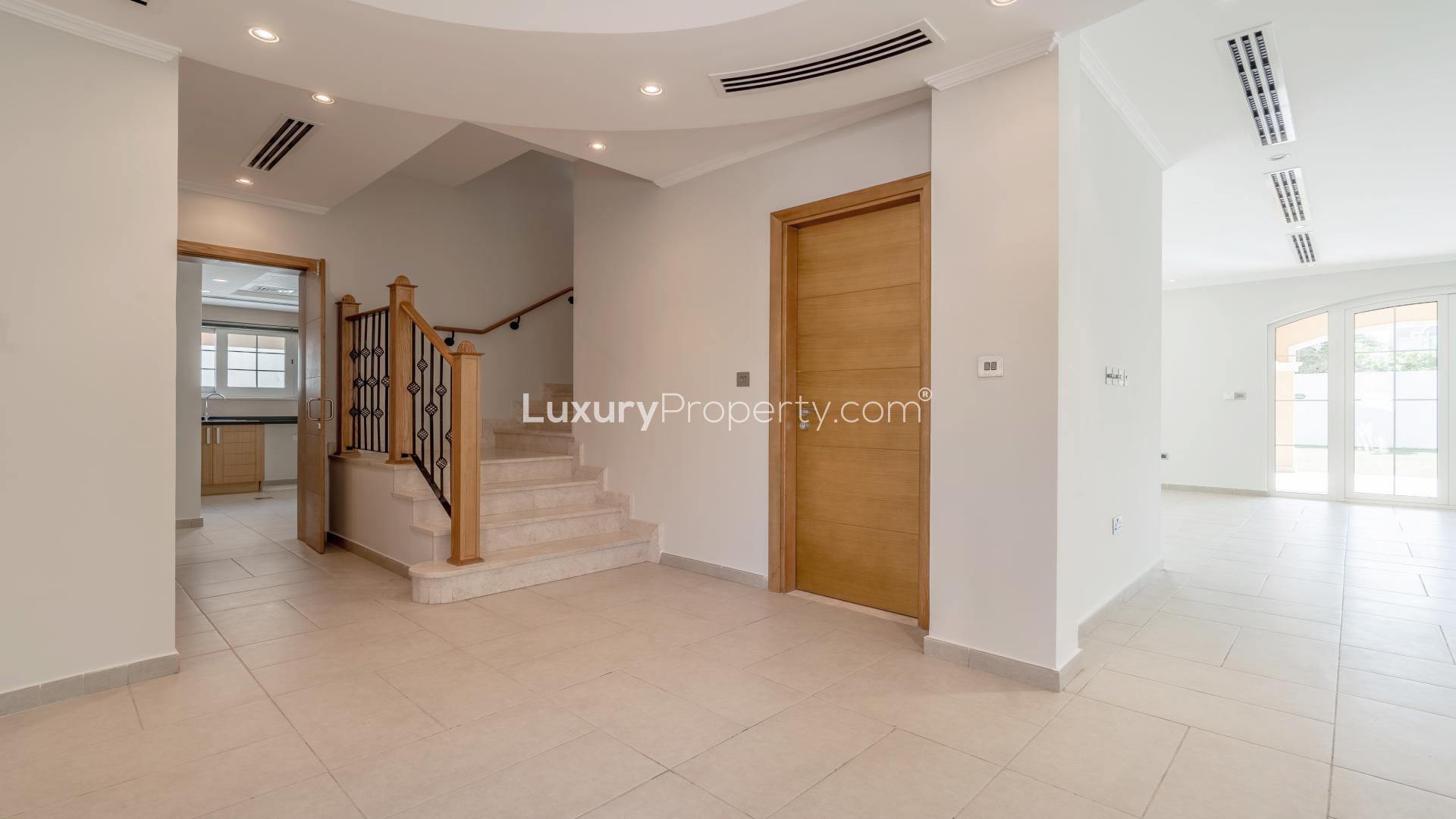 Open-plan entryway in Jumeirah Park villa with modern design and staircase