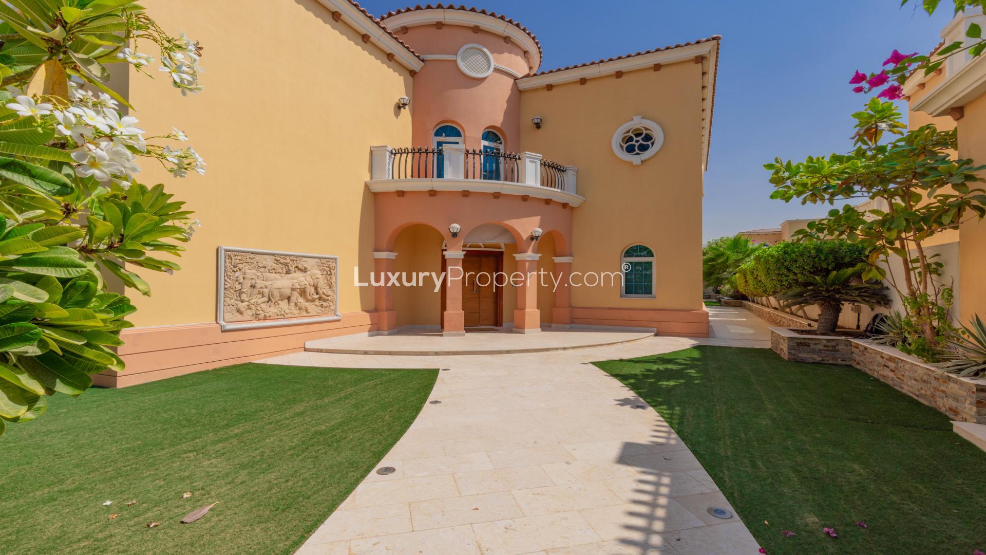 Beautifully maintained villa exterior with lush garden in Jumeirah Park Legacy community
