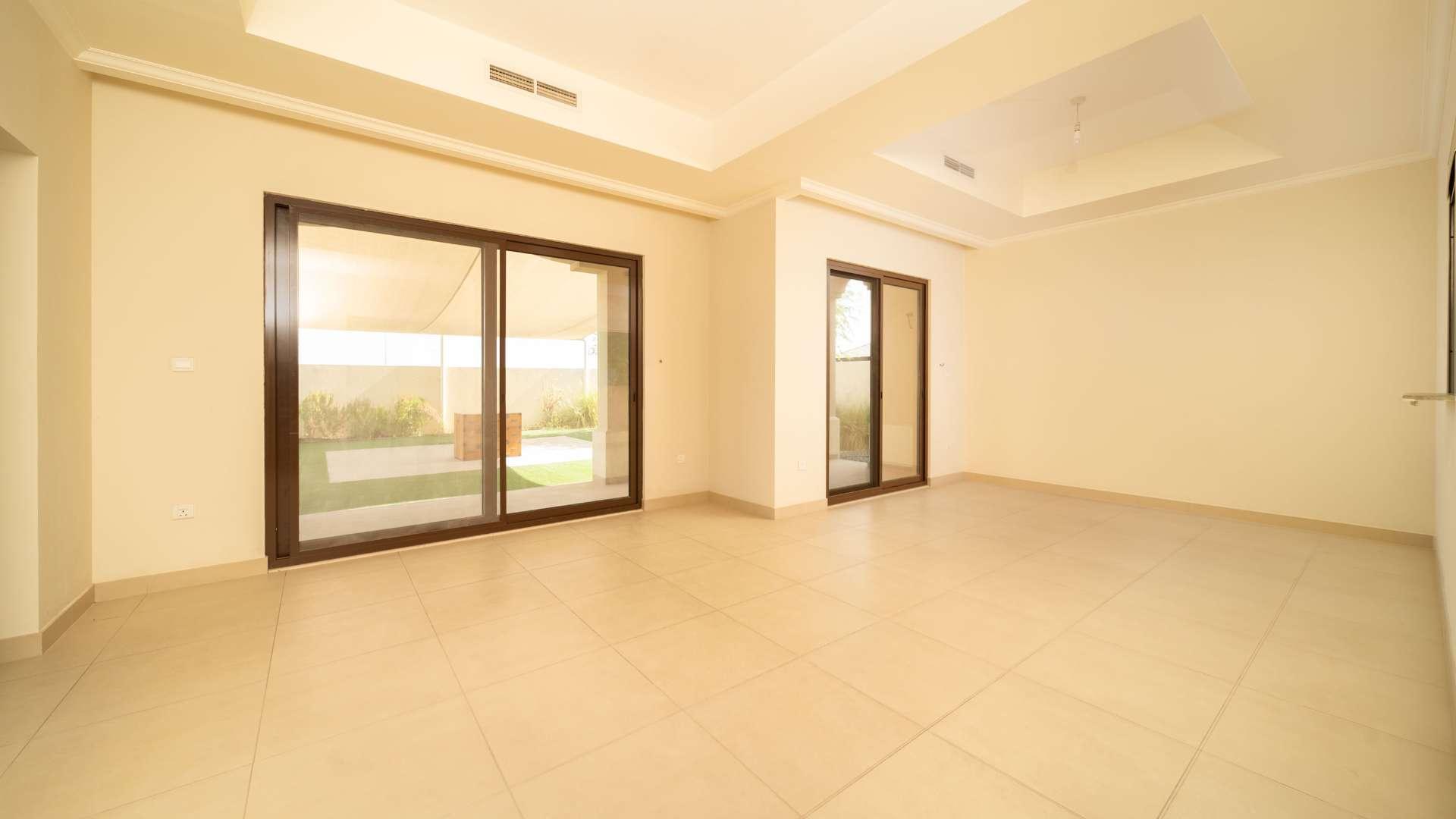 Modern kitchen with wooden cabinets in Lila villa, Arabian Ranches 2, for sale