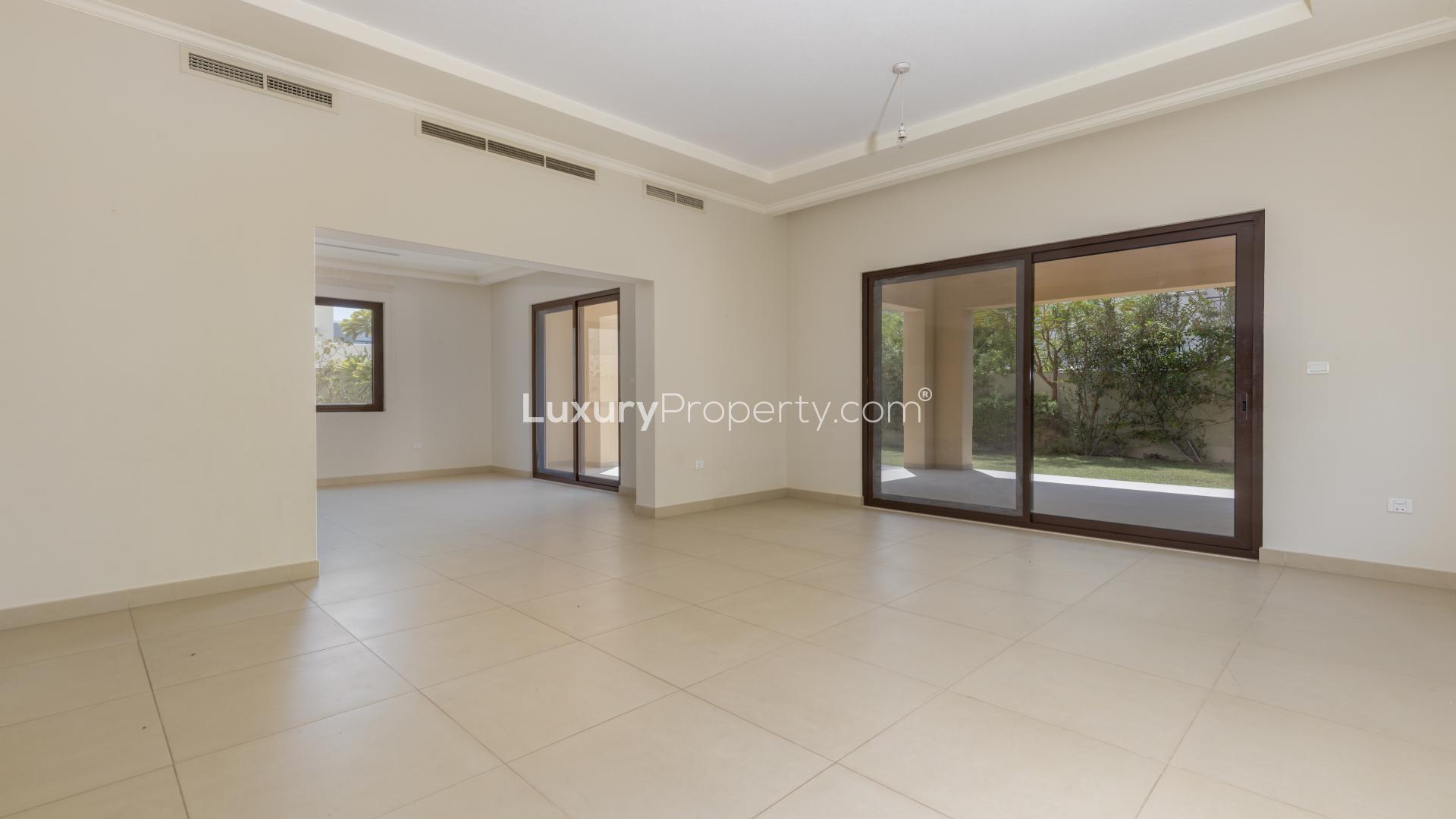 "Spacious hallway in 5-bedroom villa, Lila, Arabian Ranches 2, with natural light and garden view.",Spacious living area with large windows in Lila Villa, Arabian Ranches 2