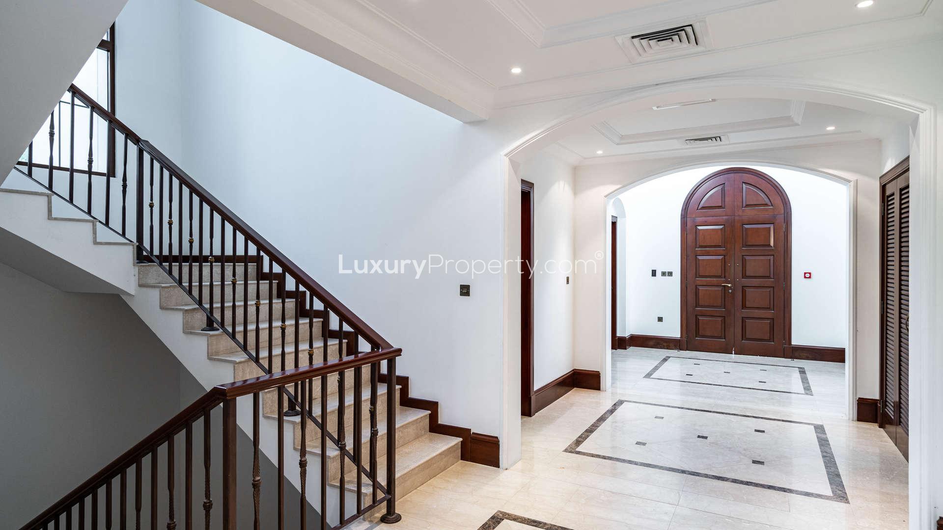 Stunning villa entrance with elegant staircase in Lime Tree Valley, Jumeirah Golf Estates