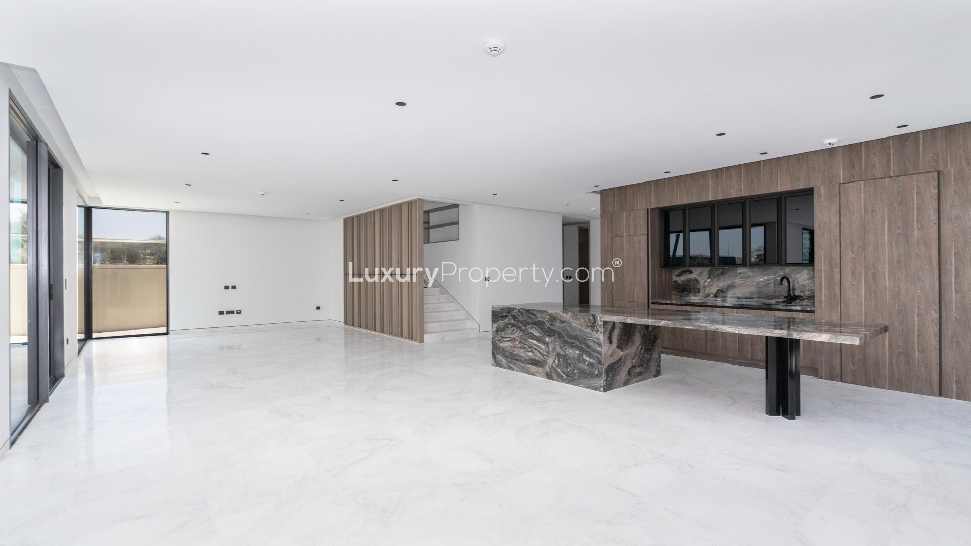 Spacious living area with marble flooring in Tilal Al Ghaf Harmony Phase 3 villa