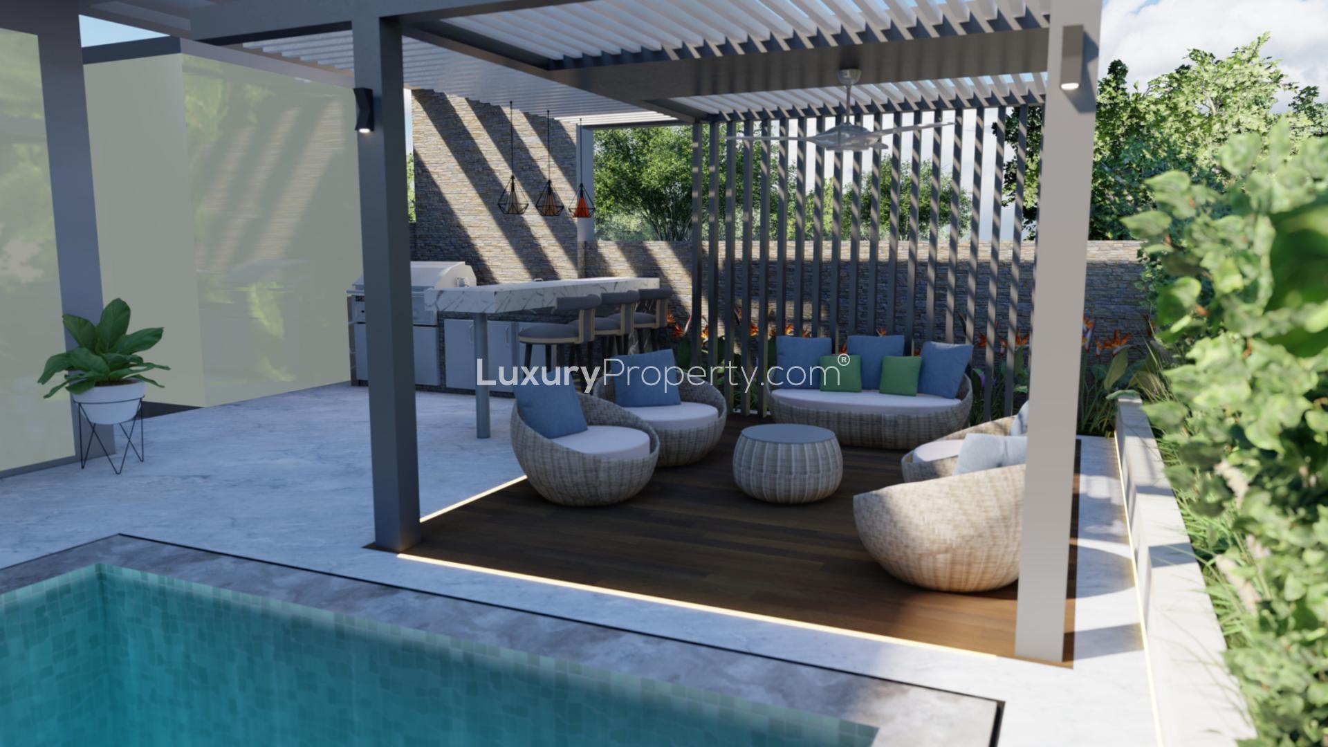 Outdoor pool view at luxury 5-bedroom villa in Harmony 3, Tilal Al Ghaf