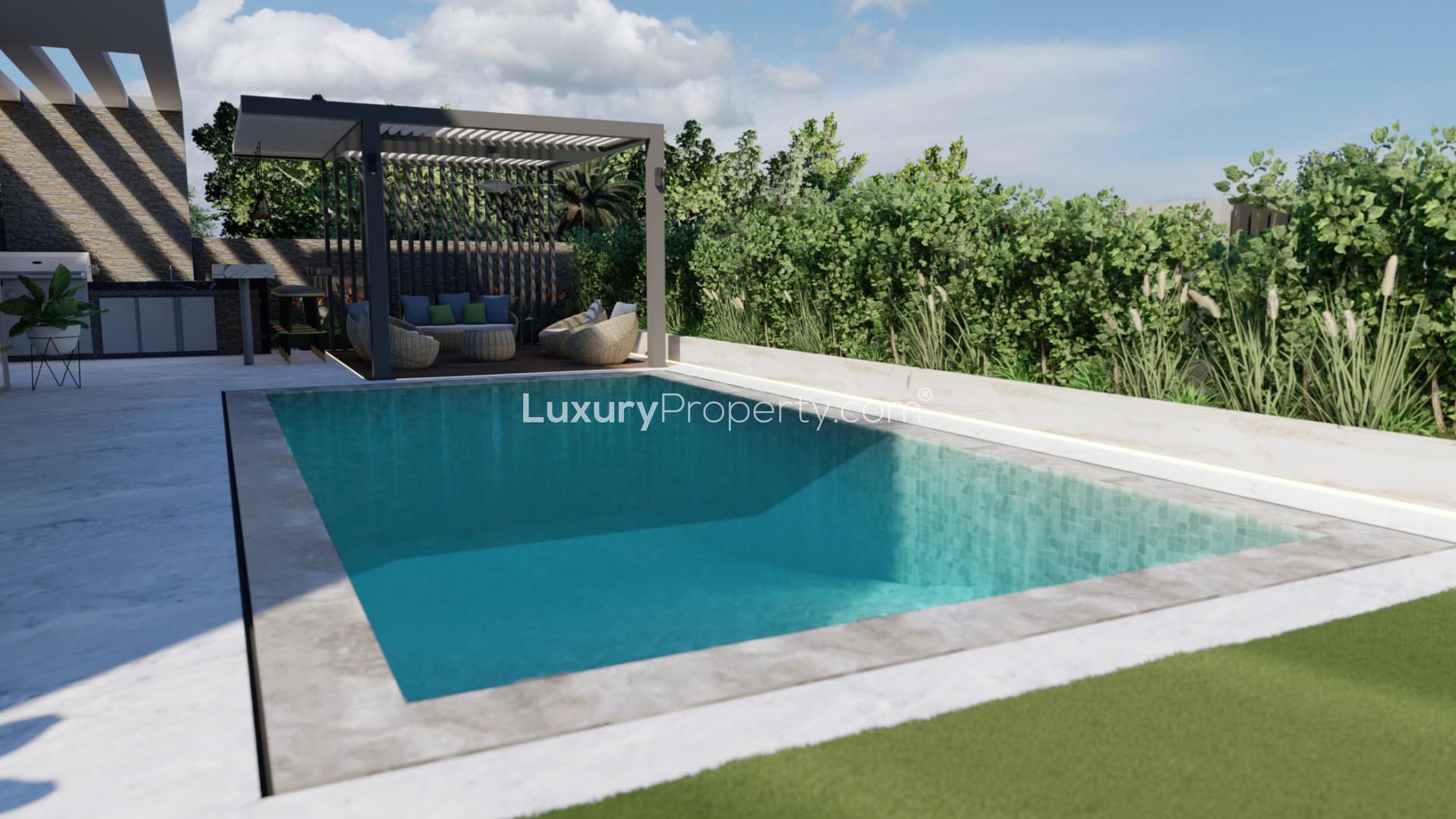 Luxurious villa with modern pool and garden in Tilal Al Ghaf, Harmony 3