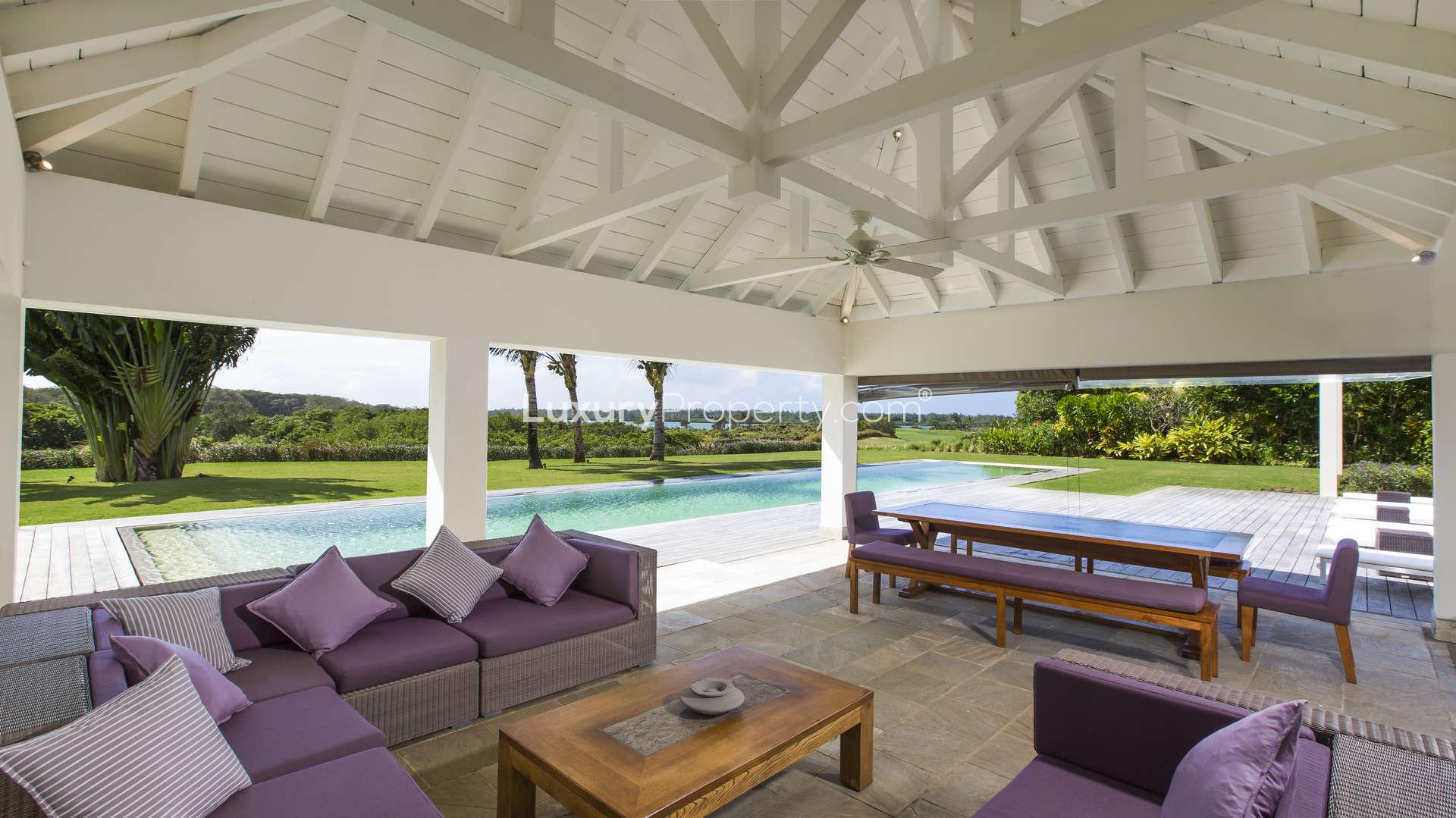 Luxurious living room in 5-bedroom villa, Anahita, Mauritius with pool and garden views