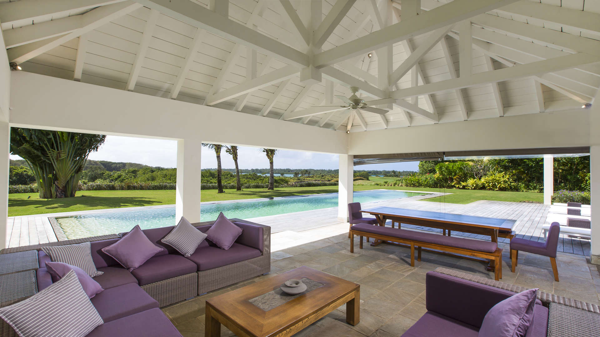 Luxurious living room in 5-bedroom villa, Anahita, Mauritius with pool and garden views