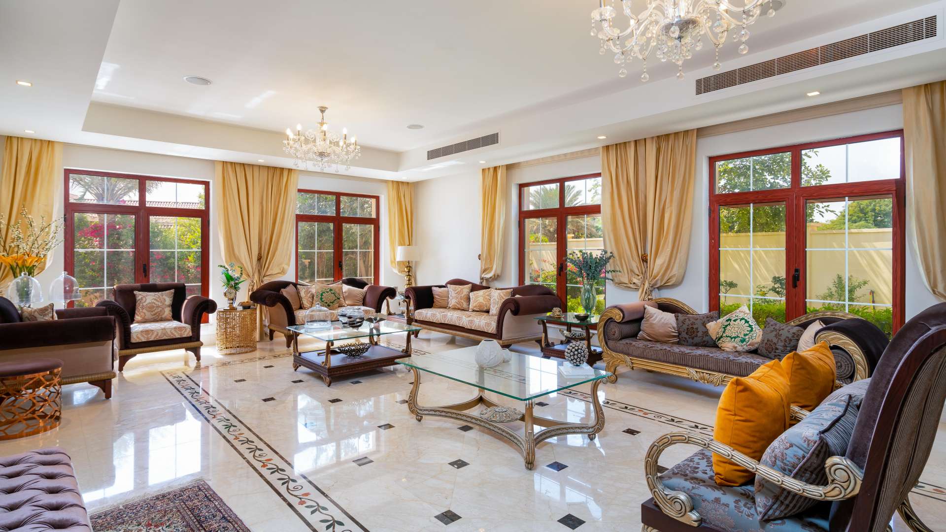 Luxurious living room in Jumeirah Islands mansion with elegant decor and large windows