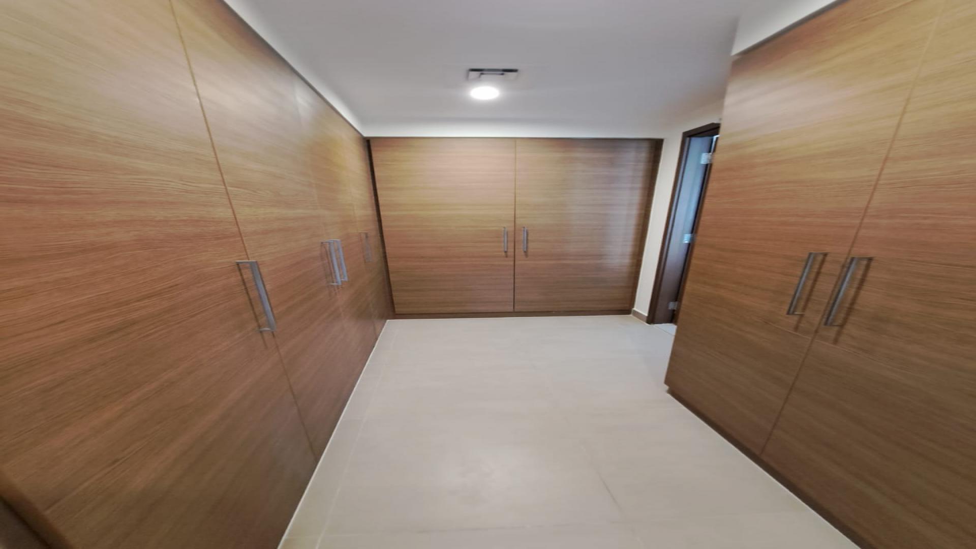 Modern living room in Sidra Villas III, Dubai Hills Estate, with sleek sofa and decor