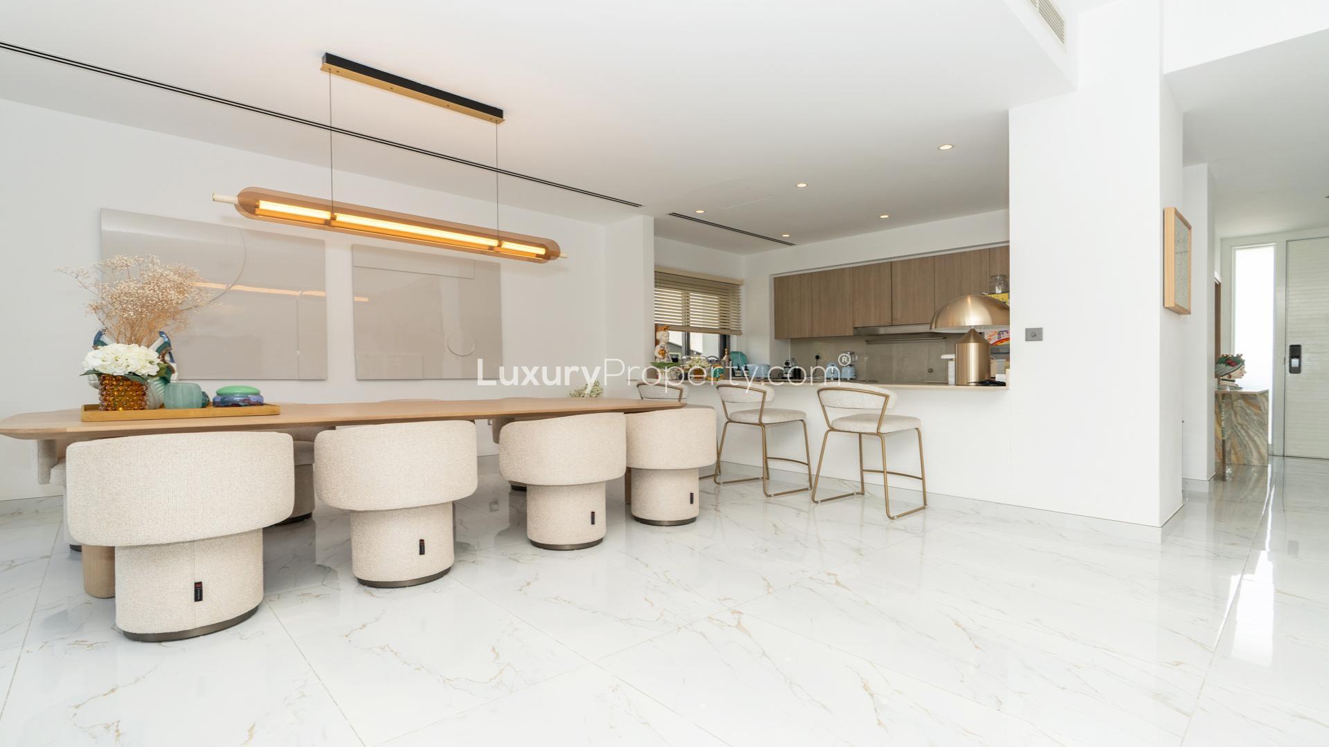 Modern living room with pool view in Sidra 1, Dubai Hills Estate villa