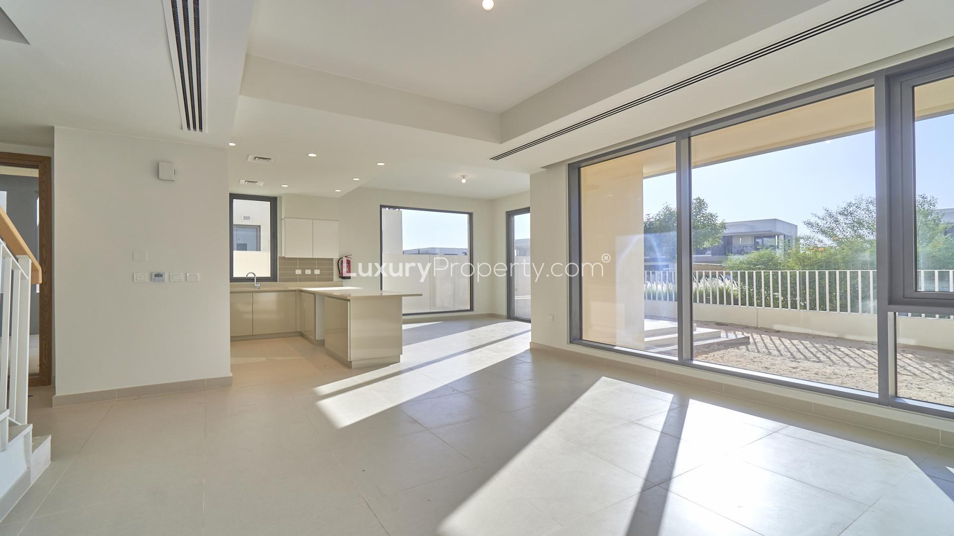 Dubai Hills Estate townhouse view with garden and community park in Maple sub-community