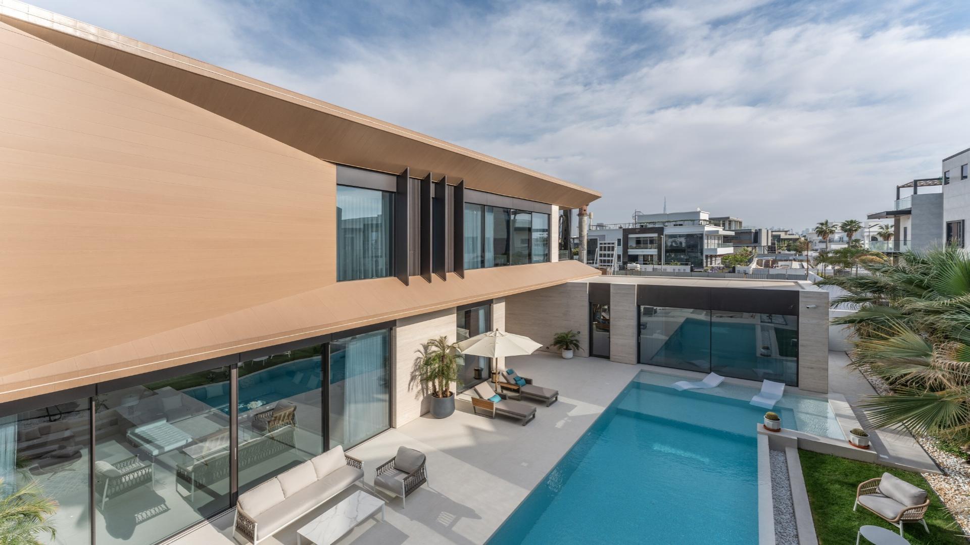 Modern villa with pool and outdoor seating in Pearl Jumeirah, Jumeirah, for sale