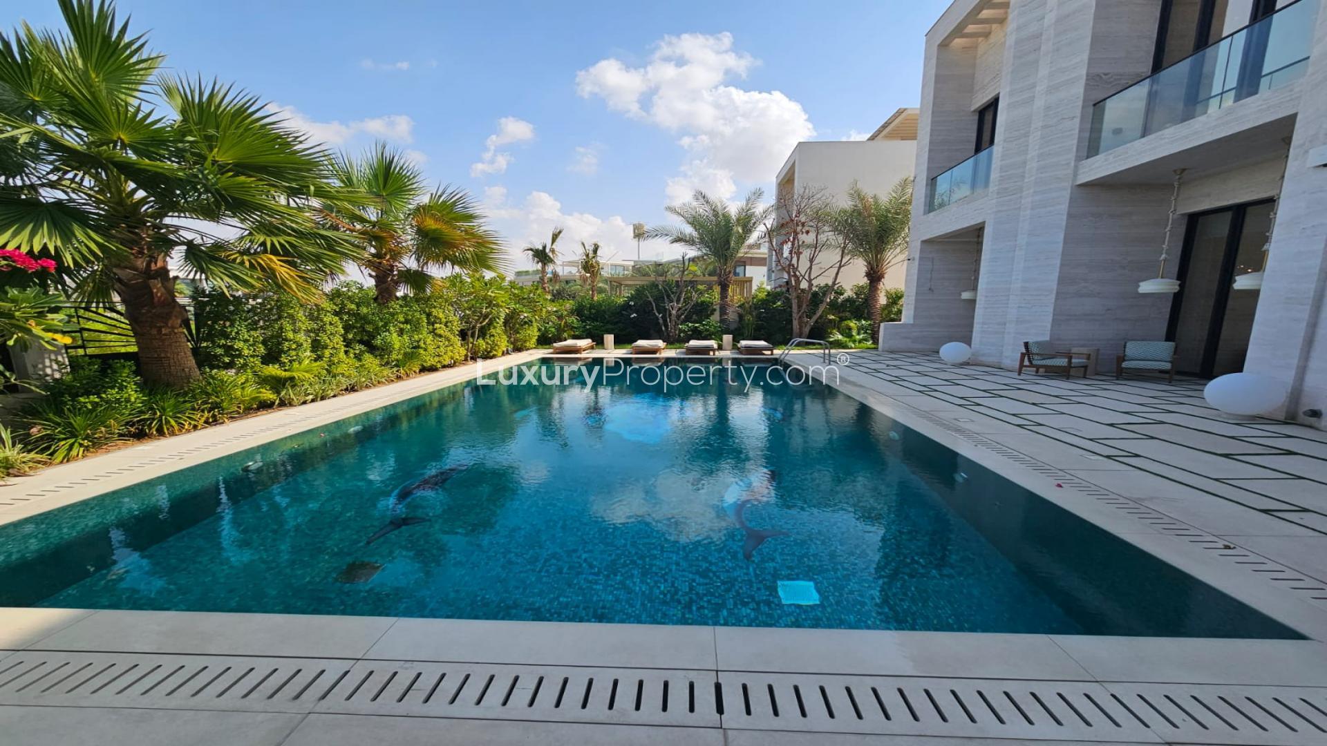 Luxurious living room in furnished bespoke mansion, Dubai Hills Estate, featuring modern decor and lighting