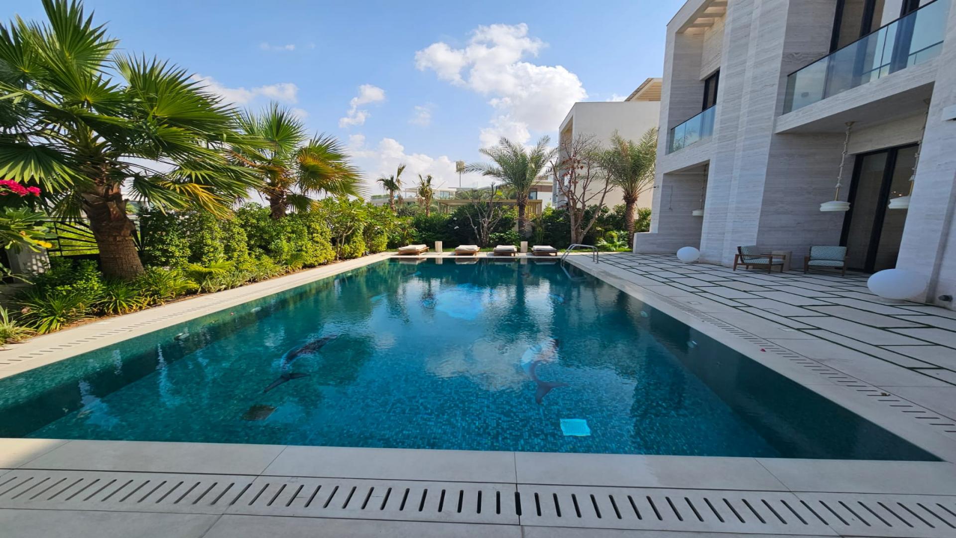 Luxurious living room in furnished bespoke mansion, Dubai Hills Estate, featuring modern decor and lighting