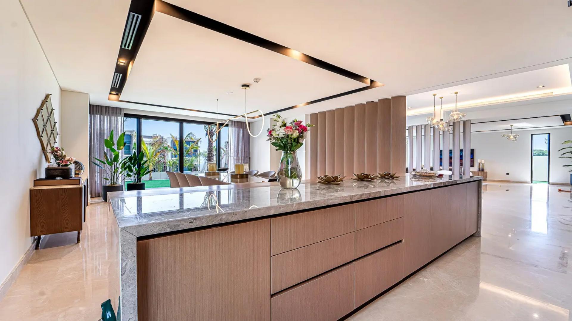 Luxurious living room in Dubai Hills Estate villa with garden view and modern decor