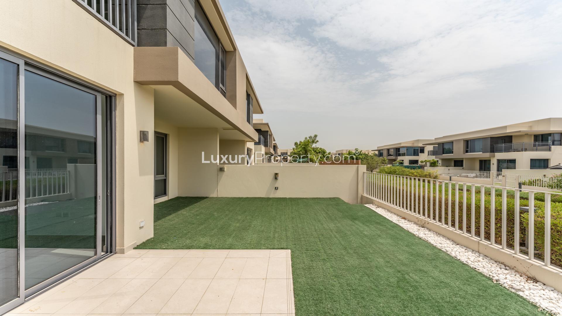 Modern villa exterior with garden, Dubai Hills Estate, Maple community, five bedrooms, for sale