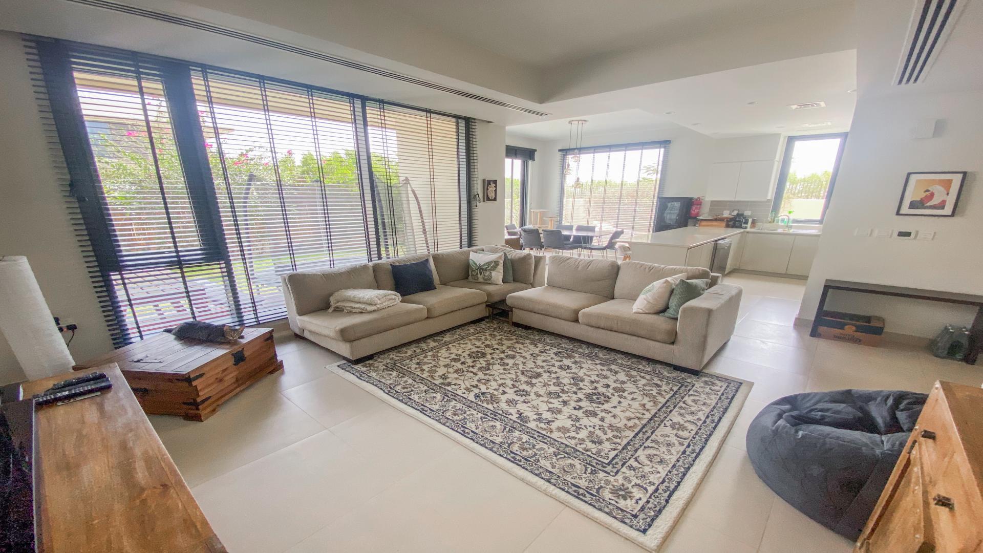 Spacious living area in Dubai Hills Estate villa, modern interior, open plan design