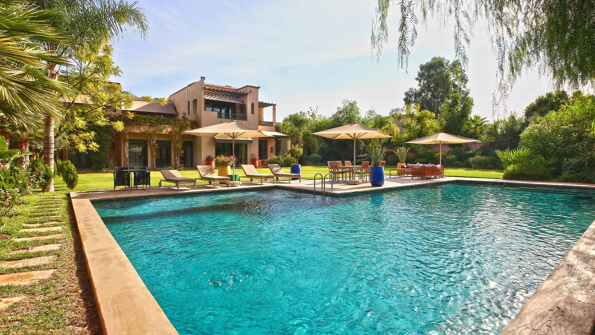 Luxury villa entrance with palm trees, Four Seasons Marrakech, for sale, 5 bedrooms