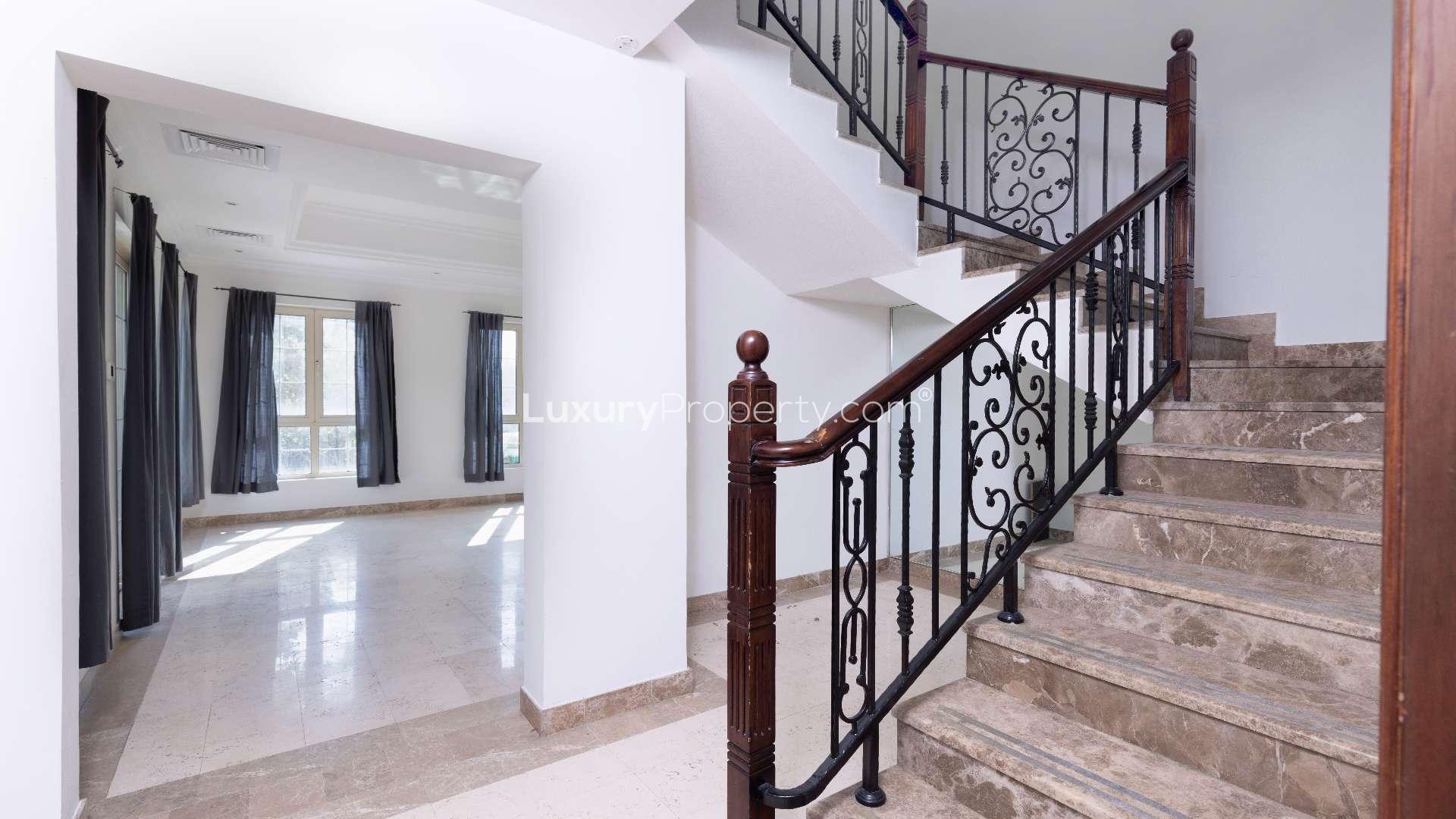 Beautiful villa exterior with manicured lawn in Jumeirah Islands, European Clusters community