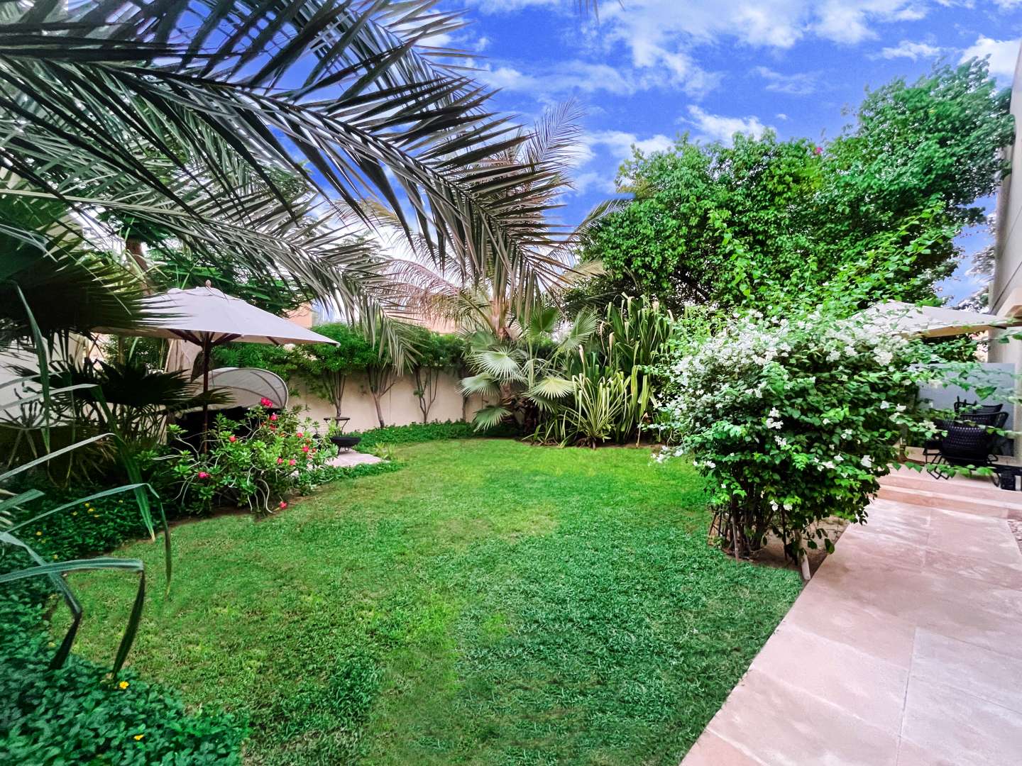 Spacious 5-bedroom villa exterior with driveway in Meadows 3, Emirates Living for sale