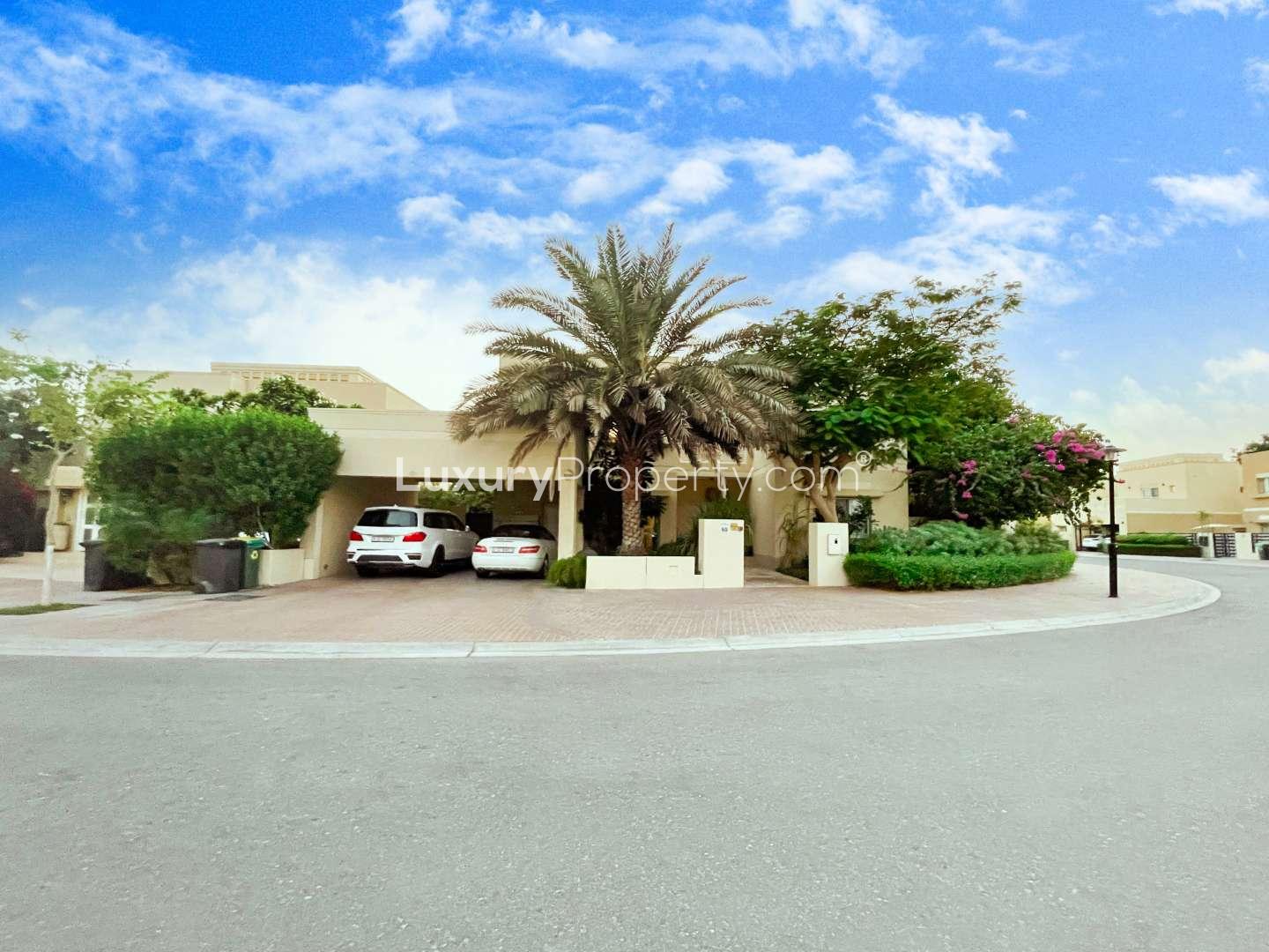 Spacious villa garden with patio seating in Meadows 3, Emirates Living, for sale