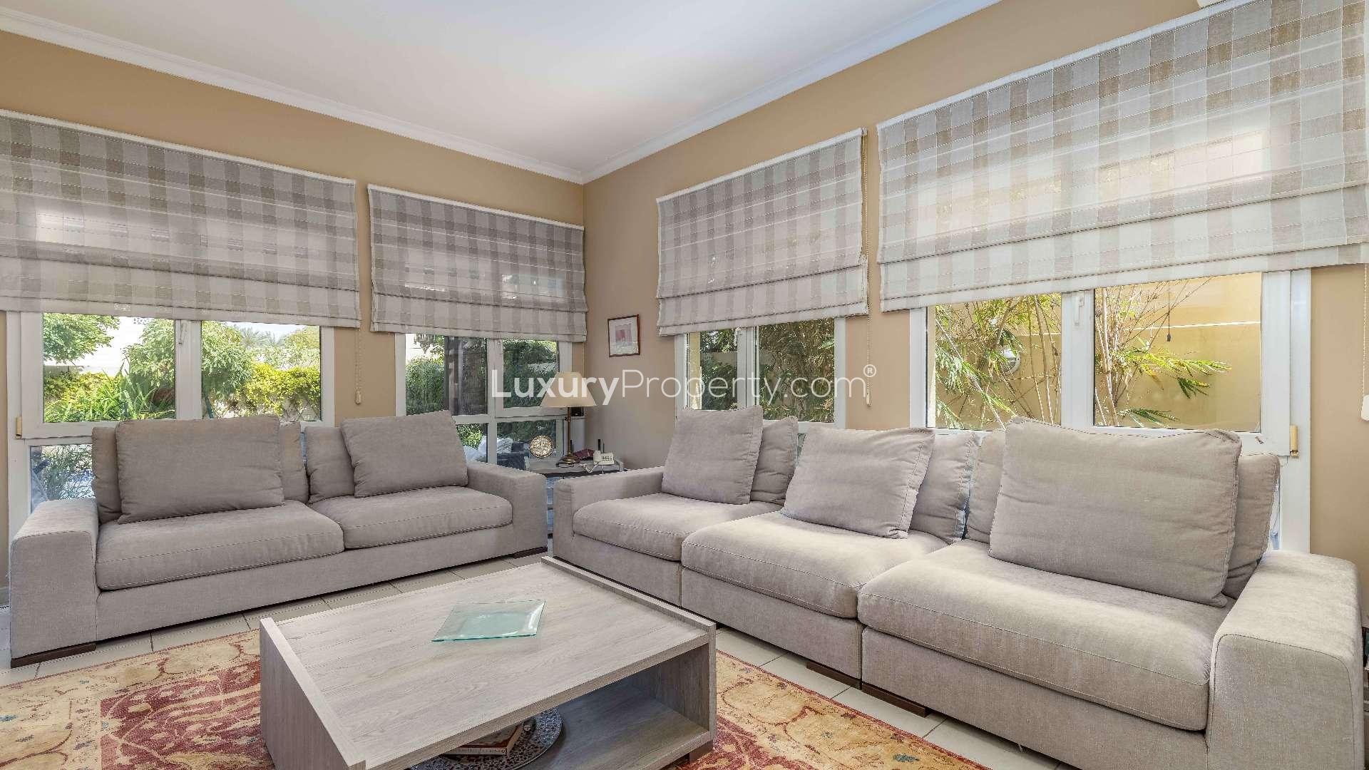 "Spacious living and dining area in upgraded 5-bedroom villa, Meadows 2, Emirates Living.",Spacious living room in upgraded 5-bedroom villa, Meadows 2, Emirates Living, for sale