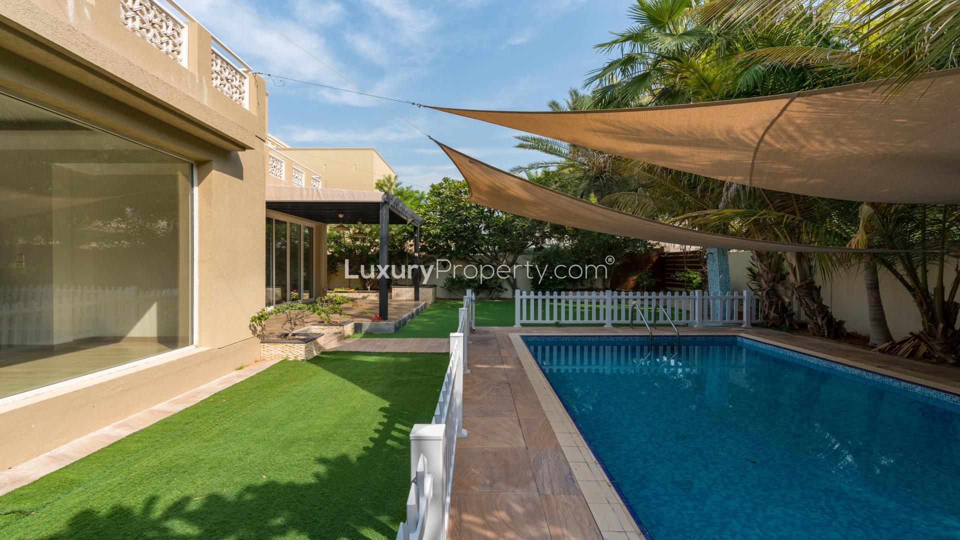 "Modern villa in Meadows, Emirates Living with private pool and landscaped garden for sale.",Modern villa with private pool and lush garden in Meadows, Emirates Living