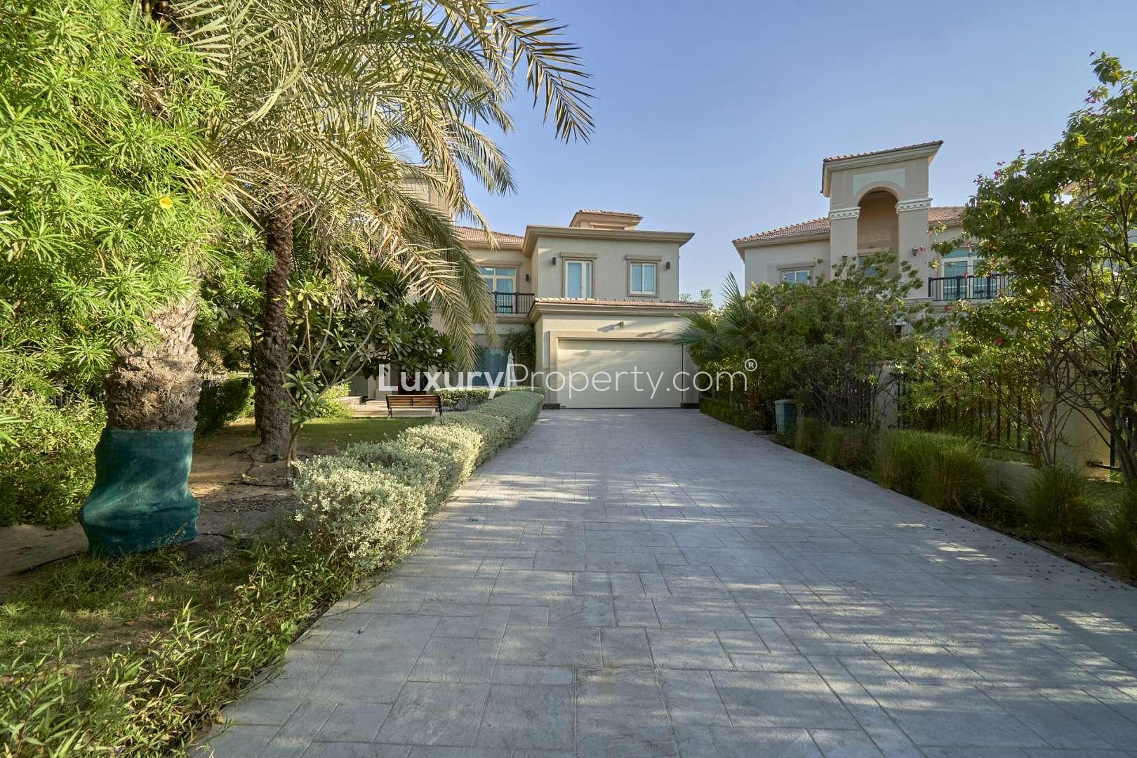 Stunning five-bedroom villa exterior in Jumeirah Islands, European Clusters, landscaped driveway