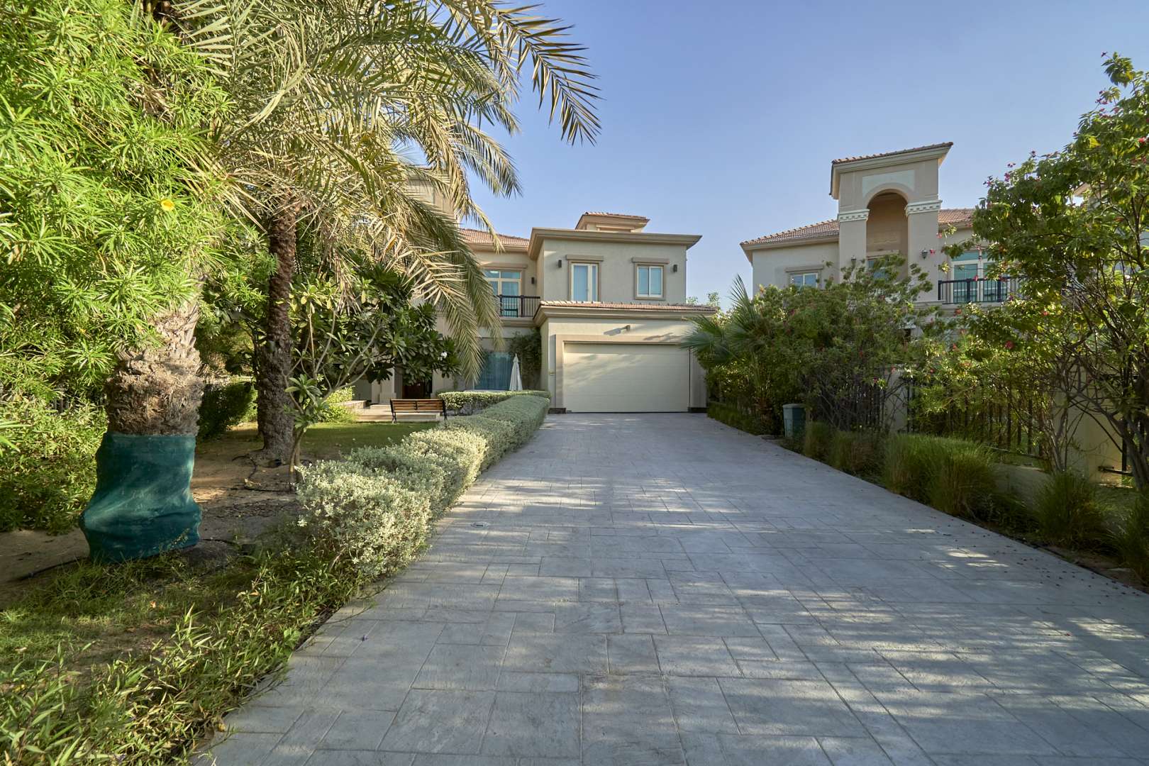 Stunning five-bedroom villa exterior in Jumeirah Islands, European Clusters, landscaped driveway